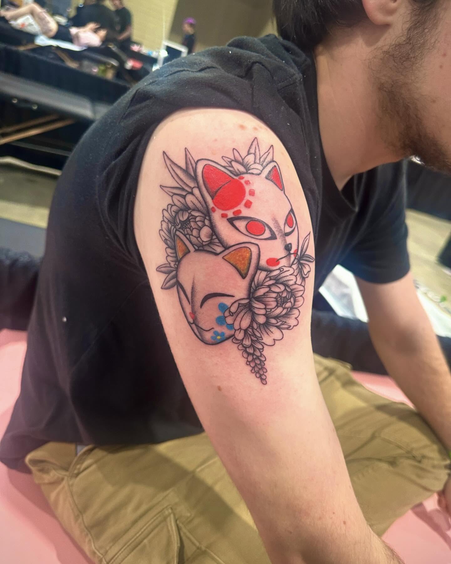 Cat mask dotwork tattoo on the forearm by Annah Lea