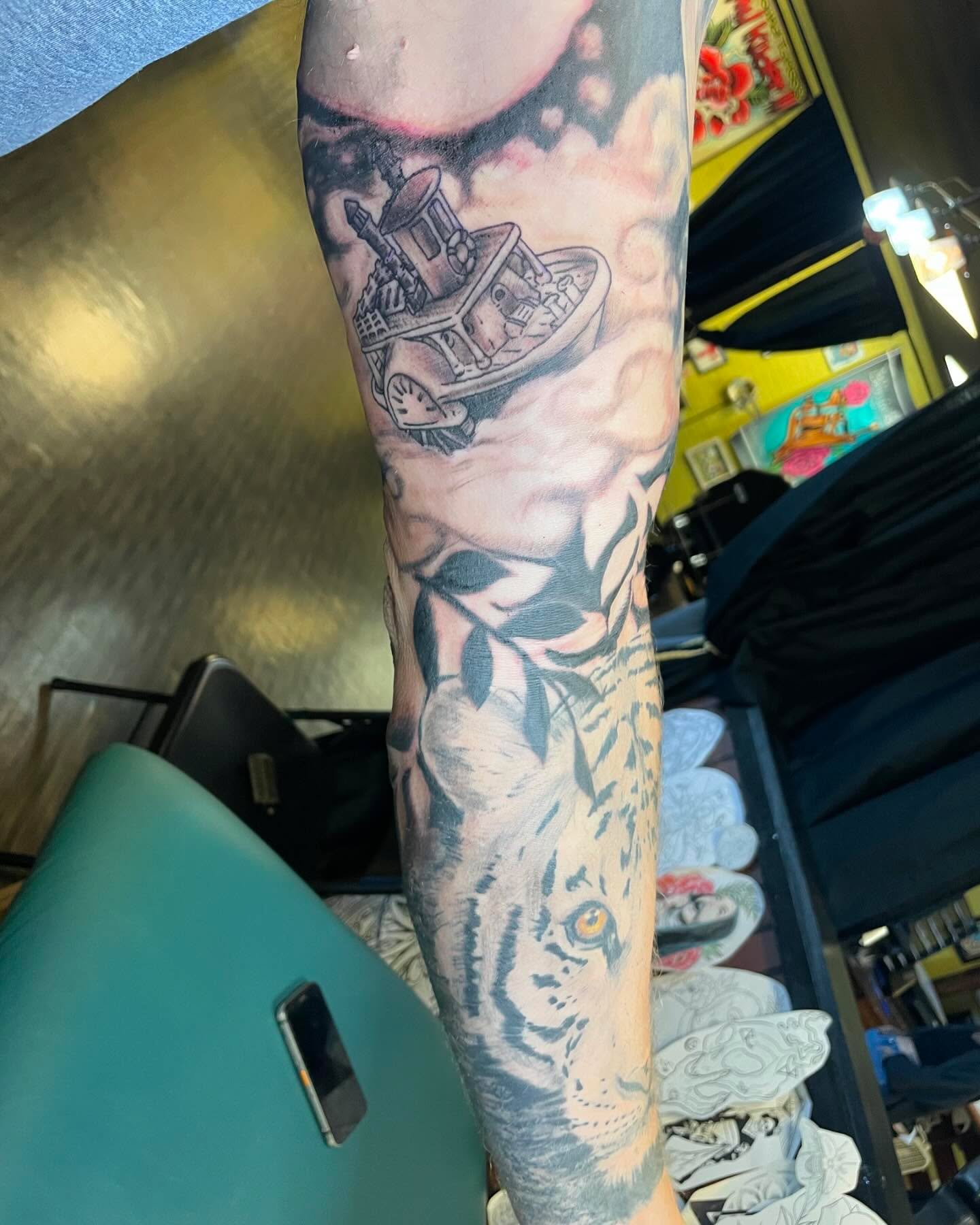 Boat and tiger realism tattoo on the forearm by Evan