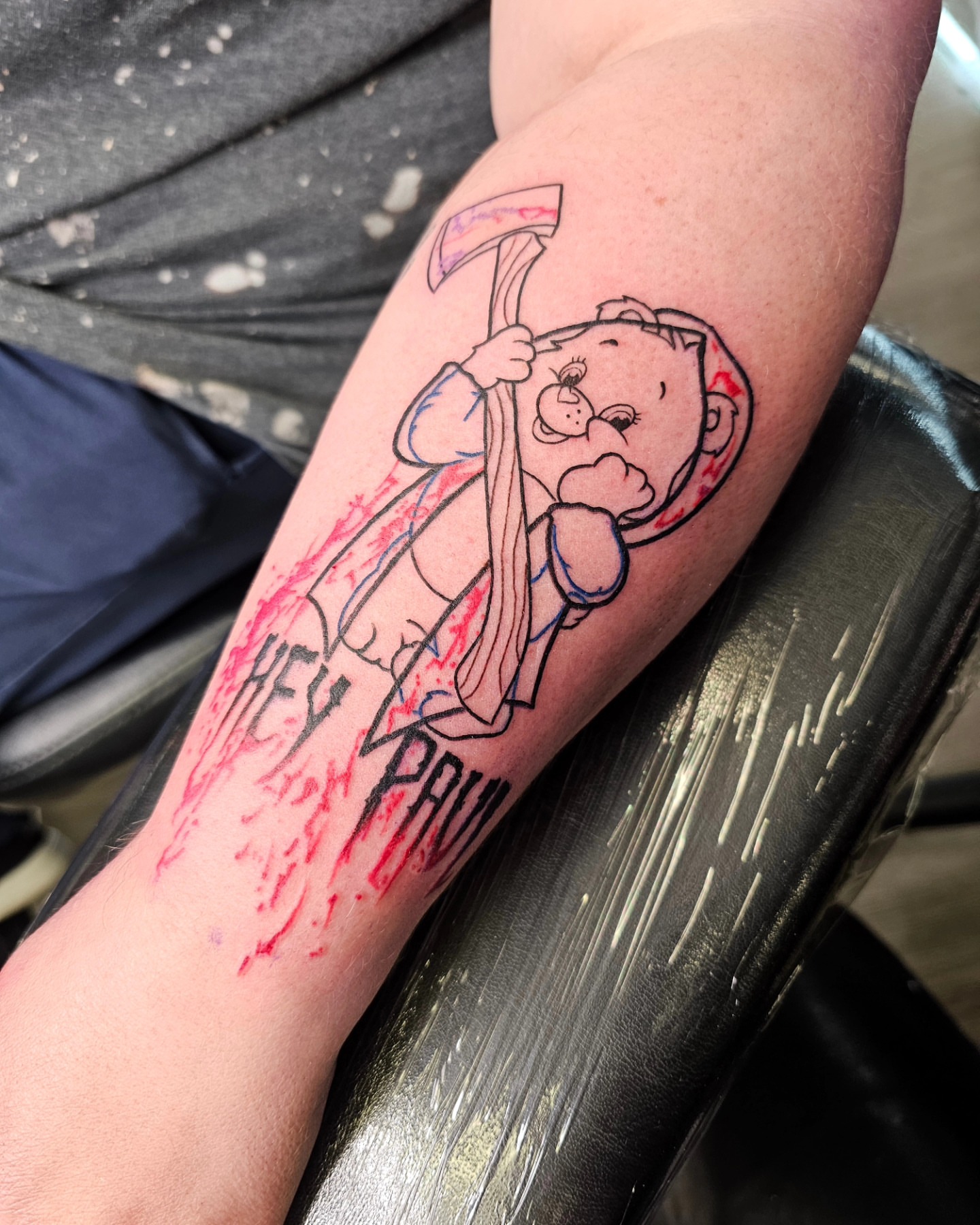 Teddy bear with axe American traditional tattoo on the forearm by Kelsey Lorrae, Ankeny, Iowa