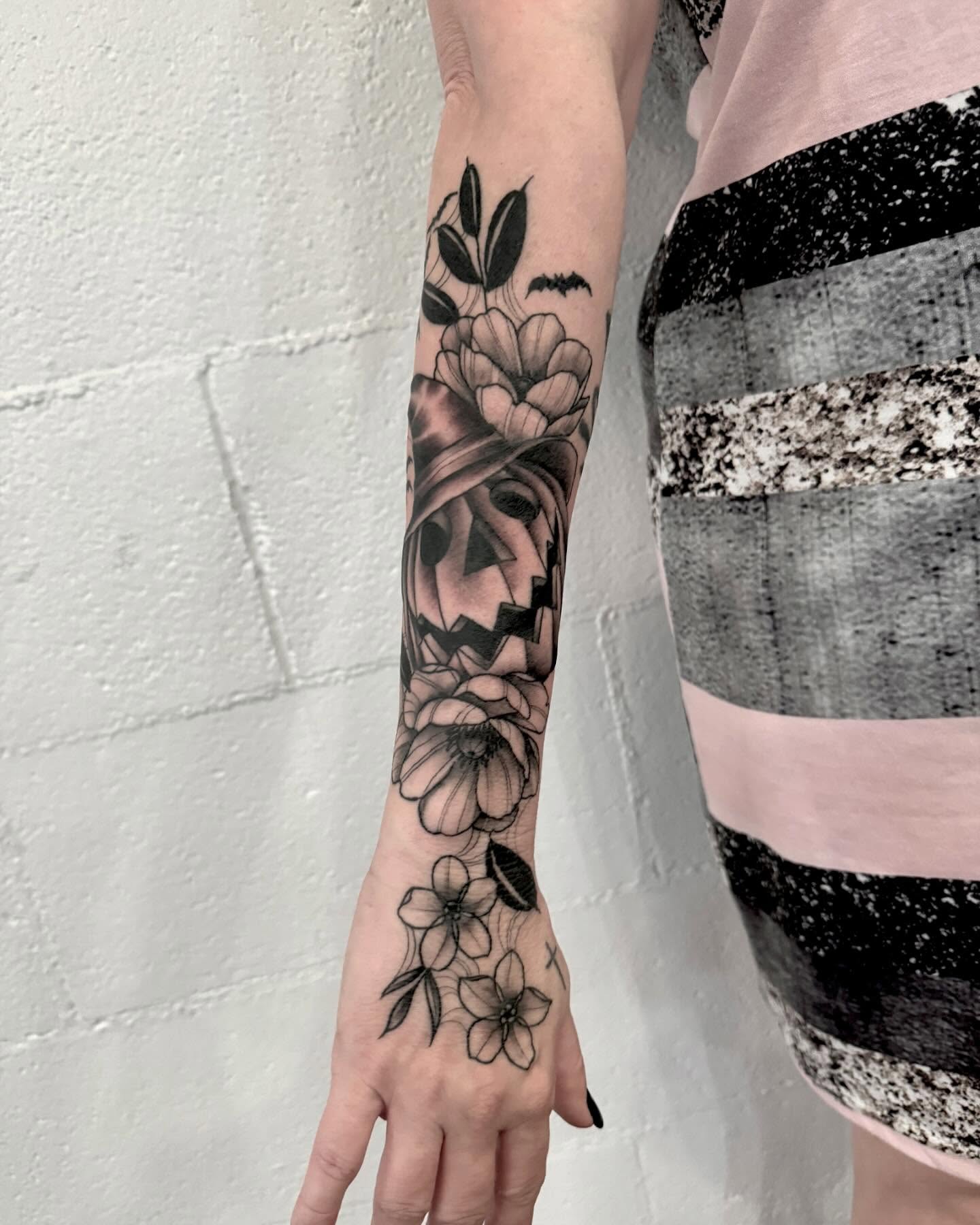 Floral bouquet black and grey tattoo on the forearm by Drew Foster, Toledo, Ohio
