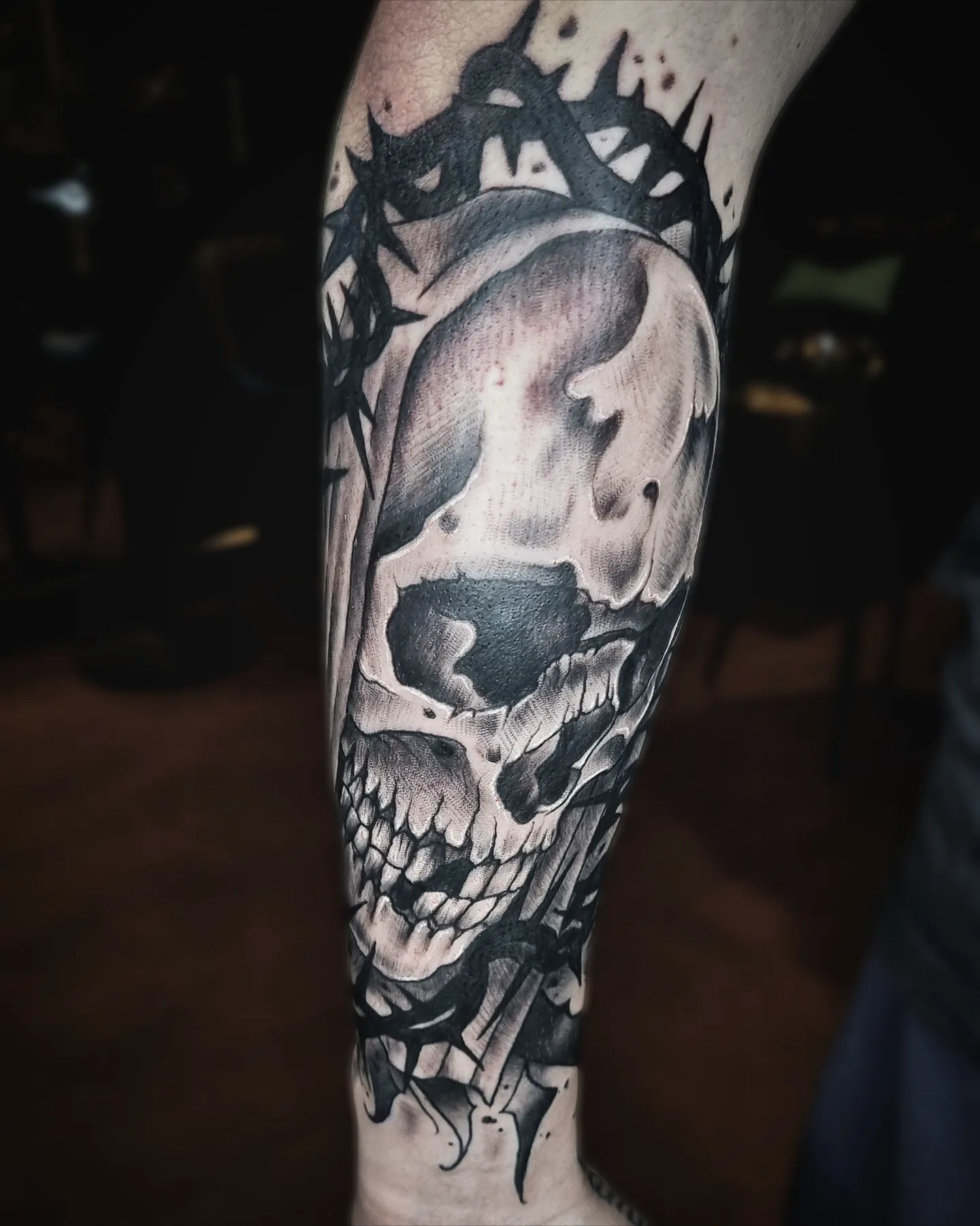 Skull with crown realism tattoo on the forearm by AntiheroTattoo