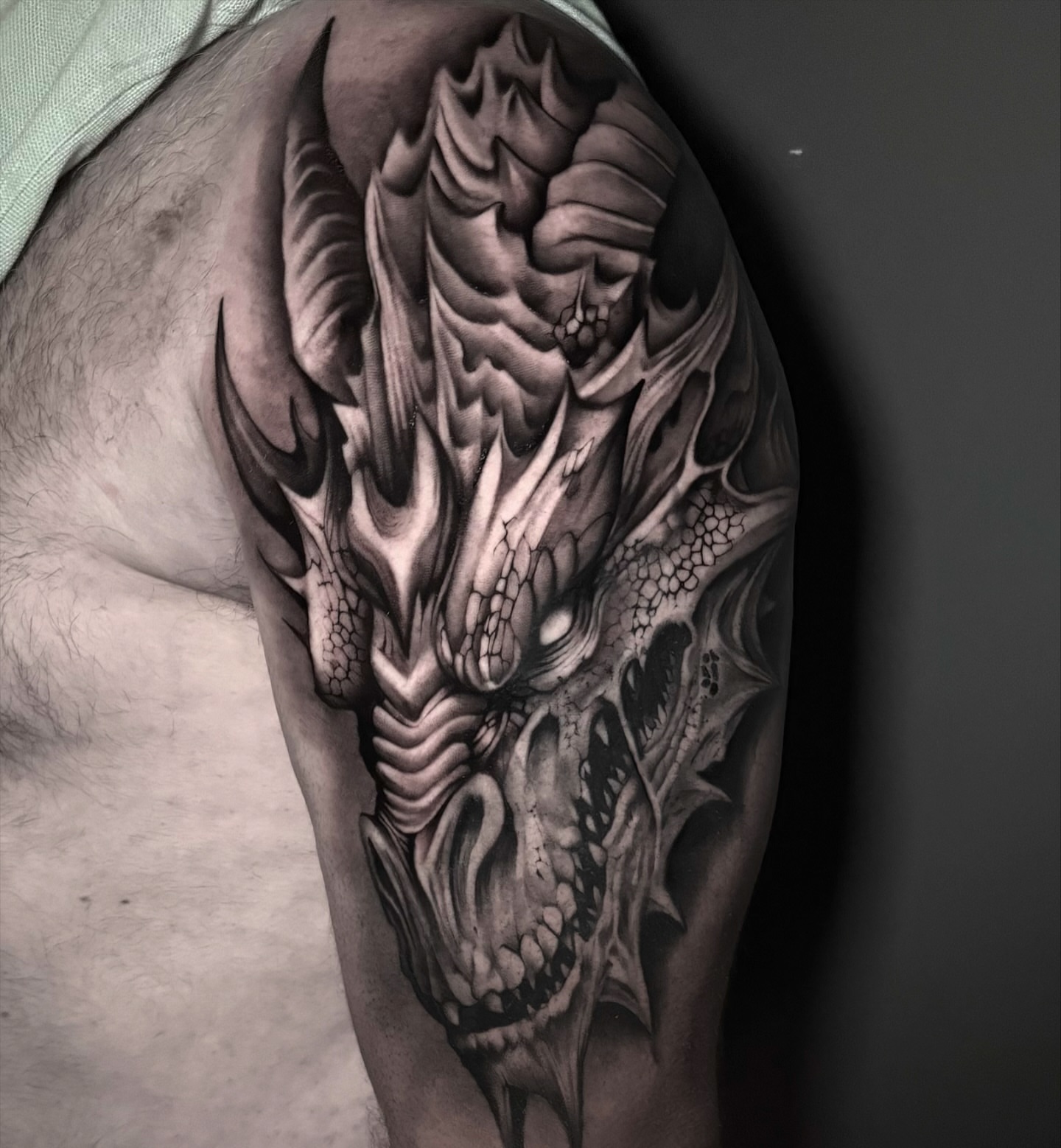 Dragon realism tattoo on the shoulder by Clayton Smith (BEAR)