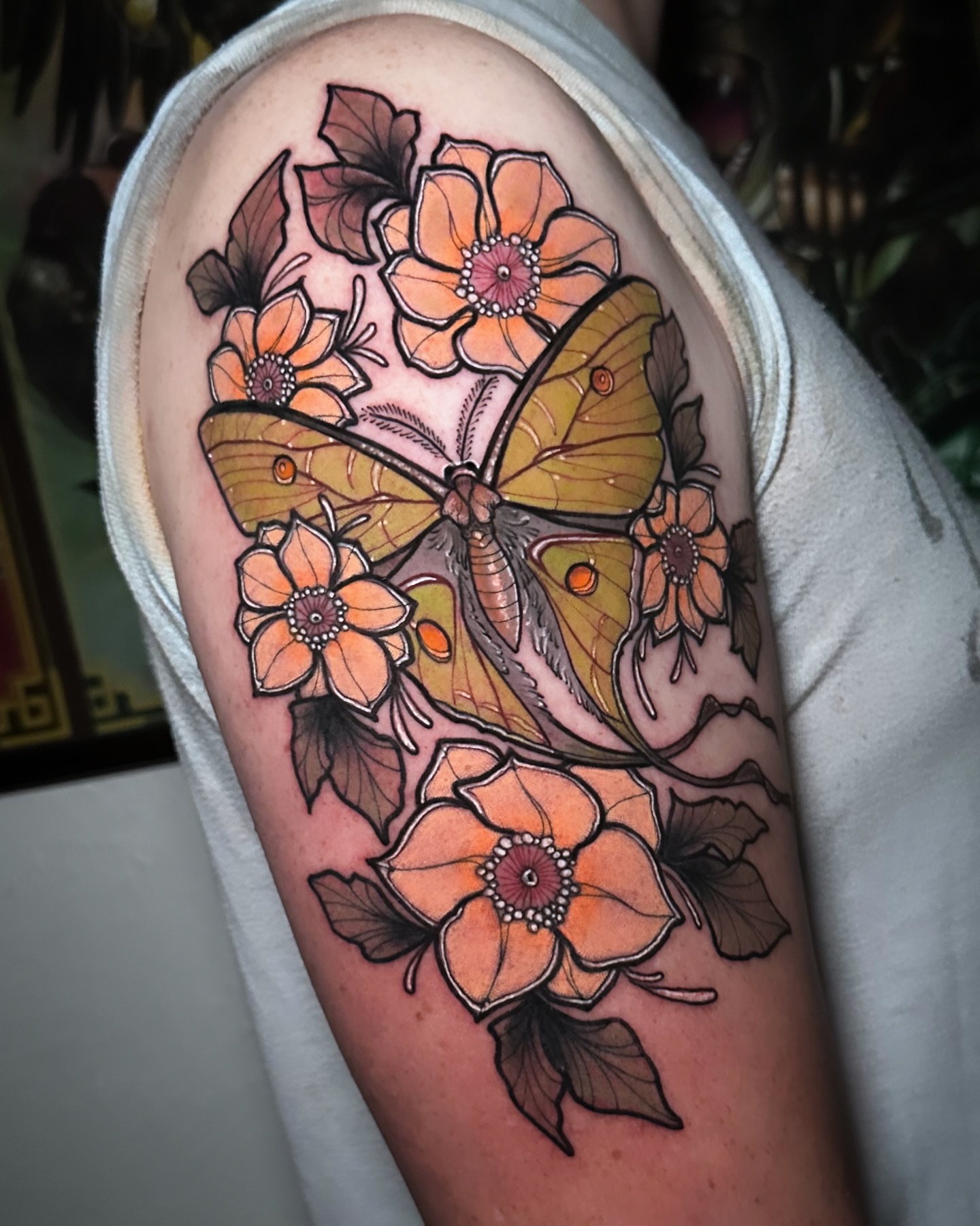 Butterfly and flowers new school tattoo on the forearm by Naysla Droguett