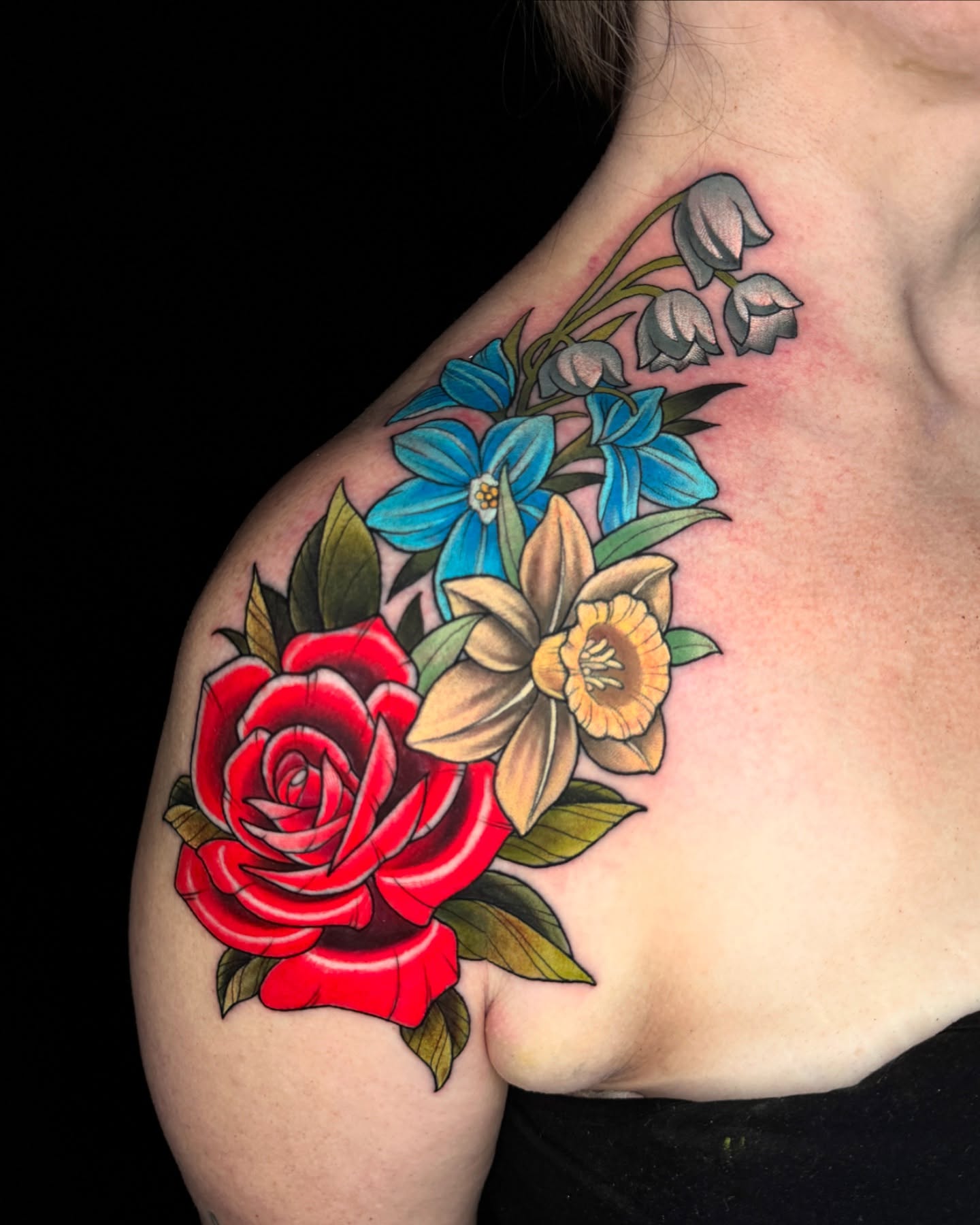 Floral arrangement American traditional tattoo on the shoulder by James Boag