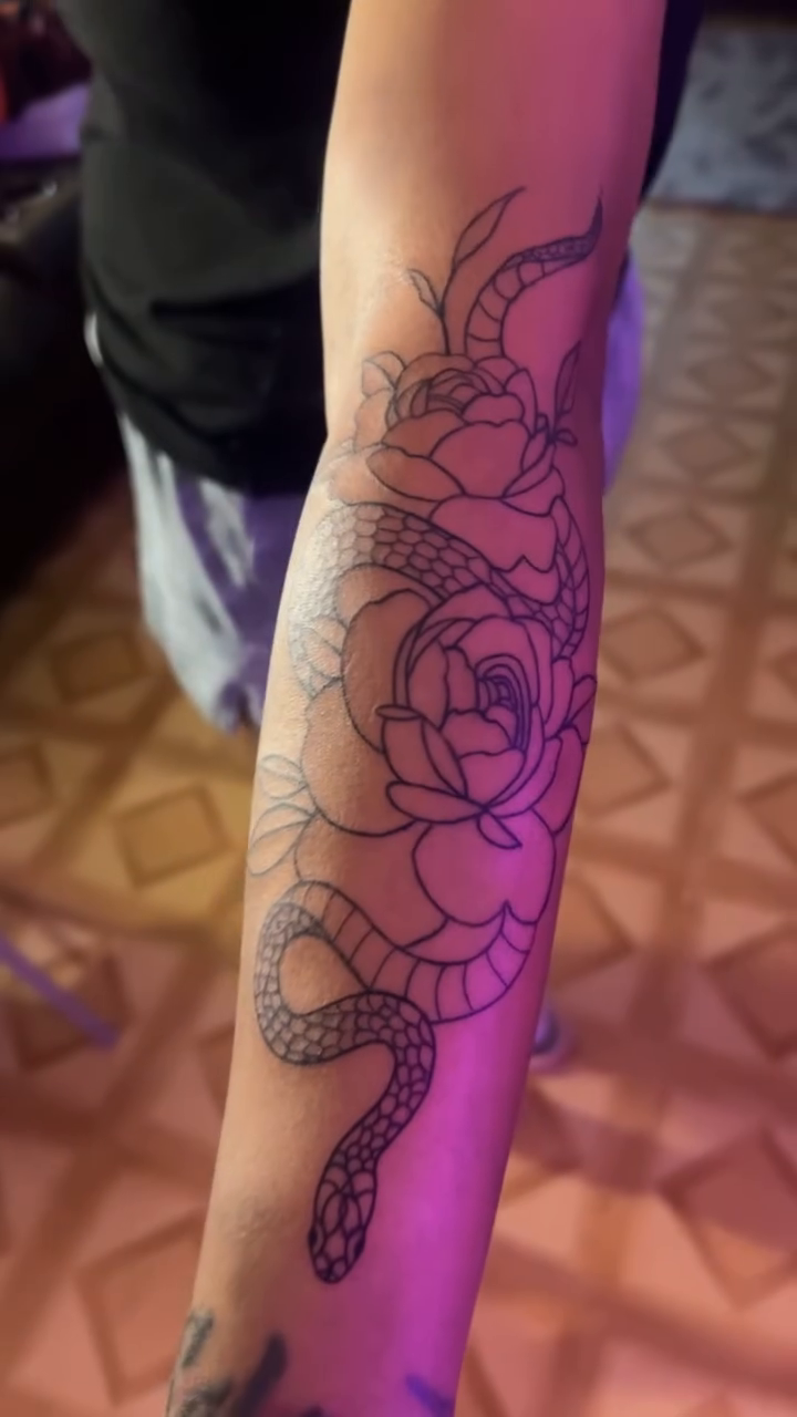 Snake and roses neo-traditional tattoo by Kells