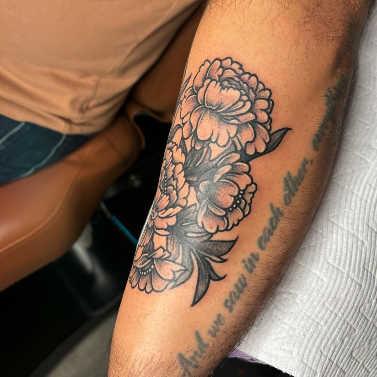 Peony flowers black and grey tattoo on the forearm by Amber N