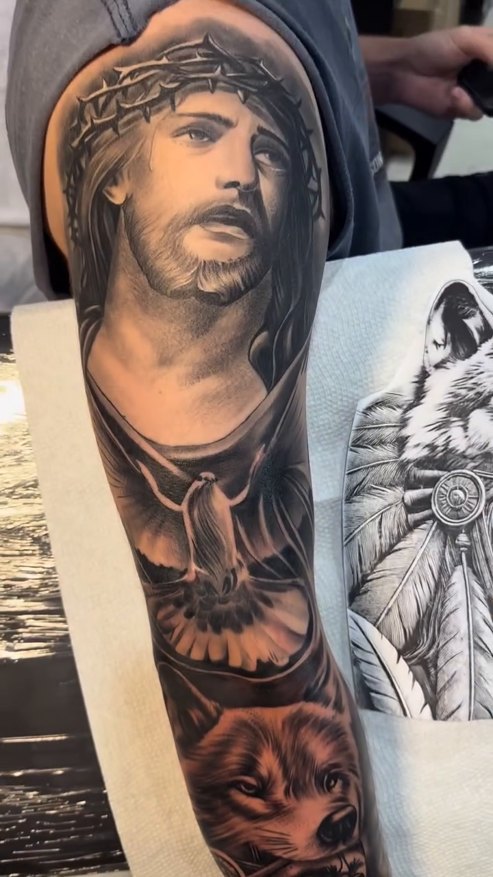 Jesus Christ and wolves realism tattoo by Tattoo