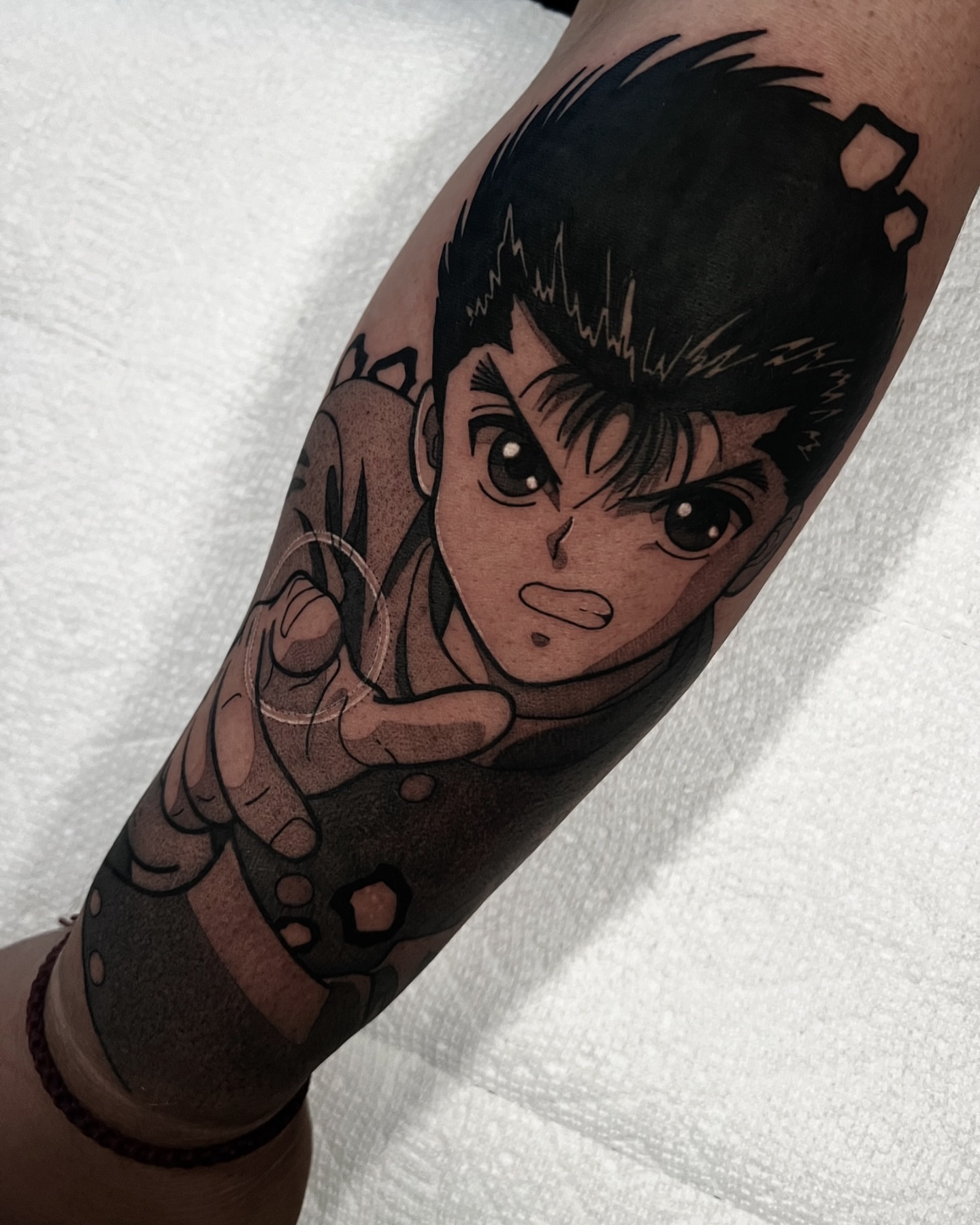 Anime character anime tattoo on the forearm by Chandler Roe