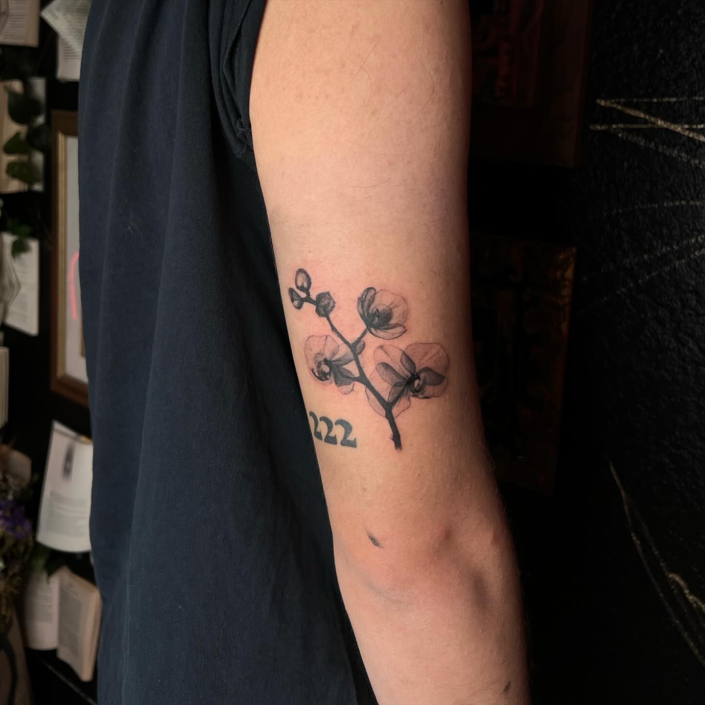 Orchid black and grey tattoo on the forearm by Ladyjutsu