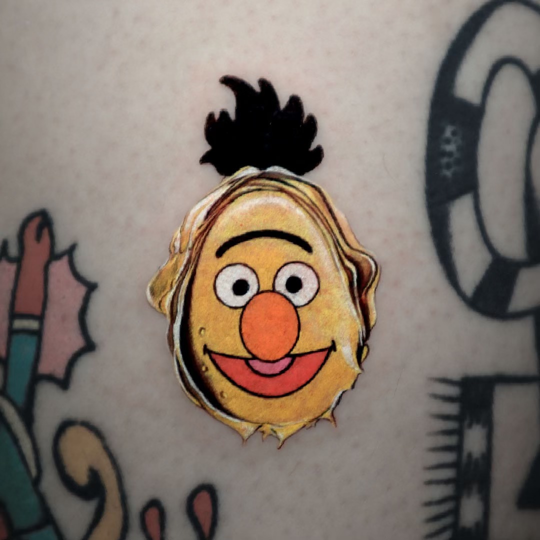 Sesame street character illustrative tattoo on the forearm by Greeni