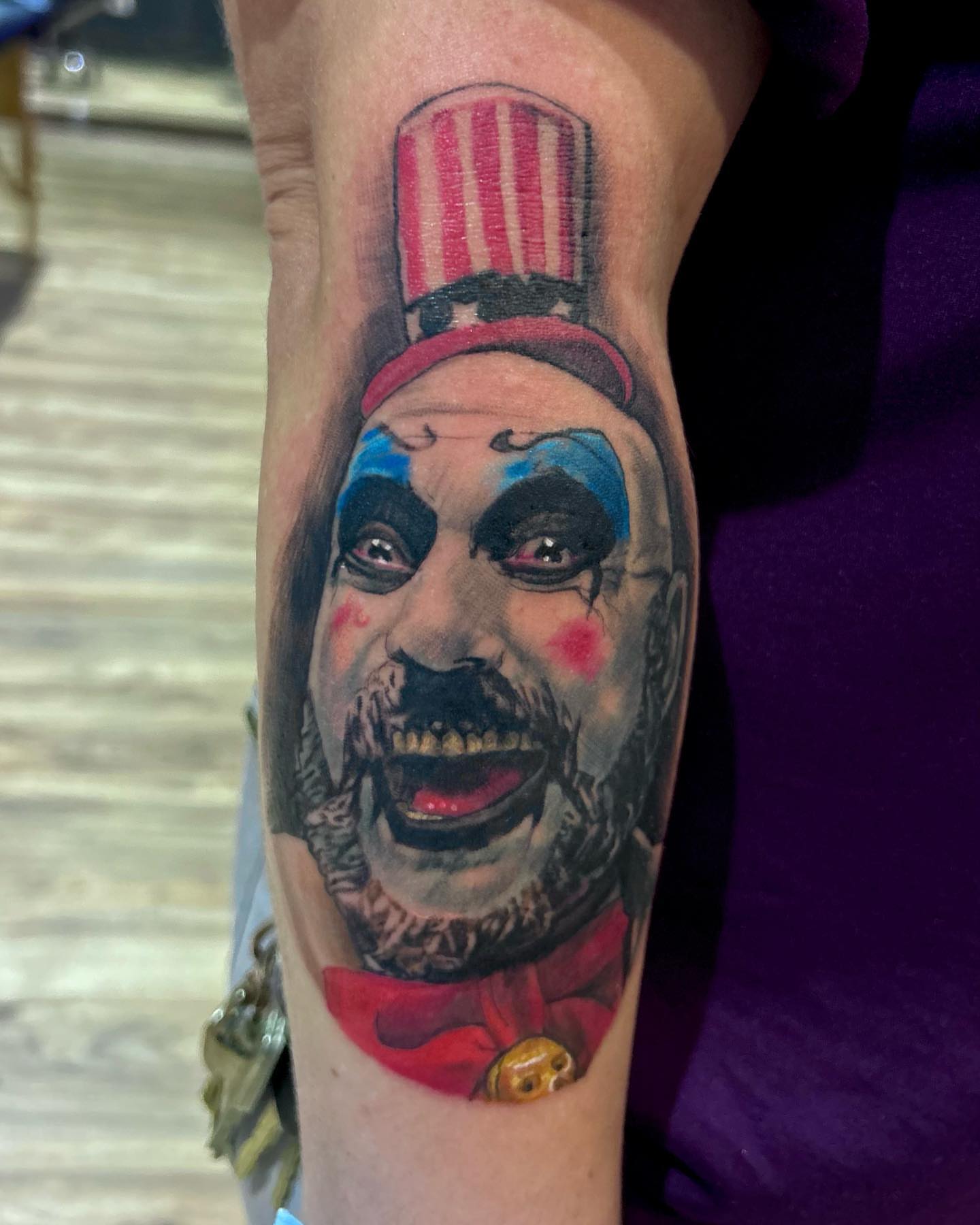 Clown realism tattoo on the forearm by Cody Lambert