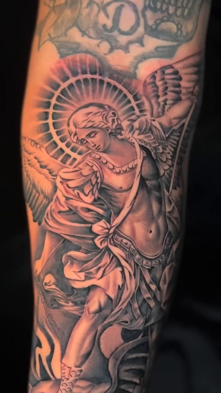 Angel with halo and wings realism tattoo by Brayan Molina