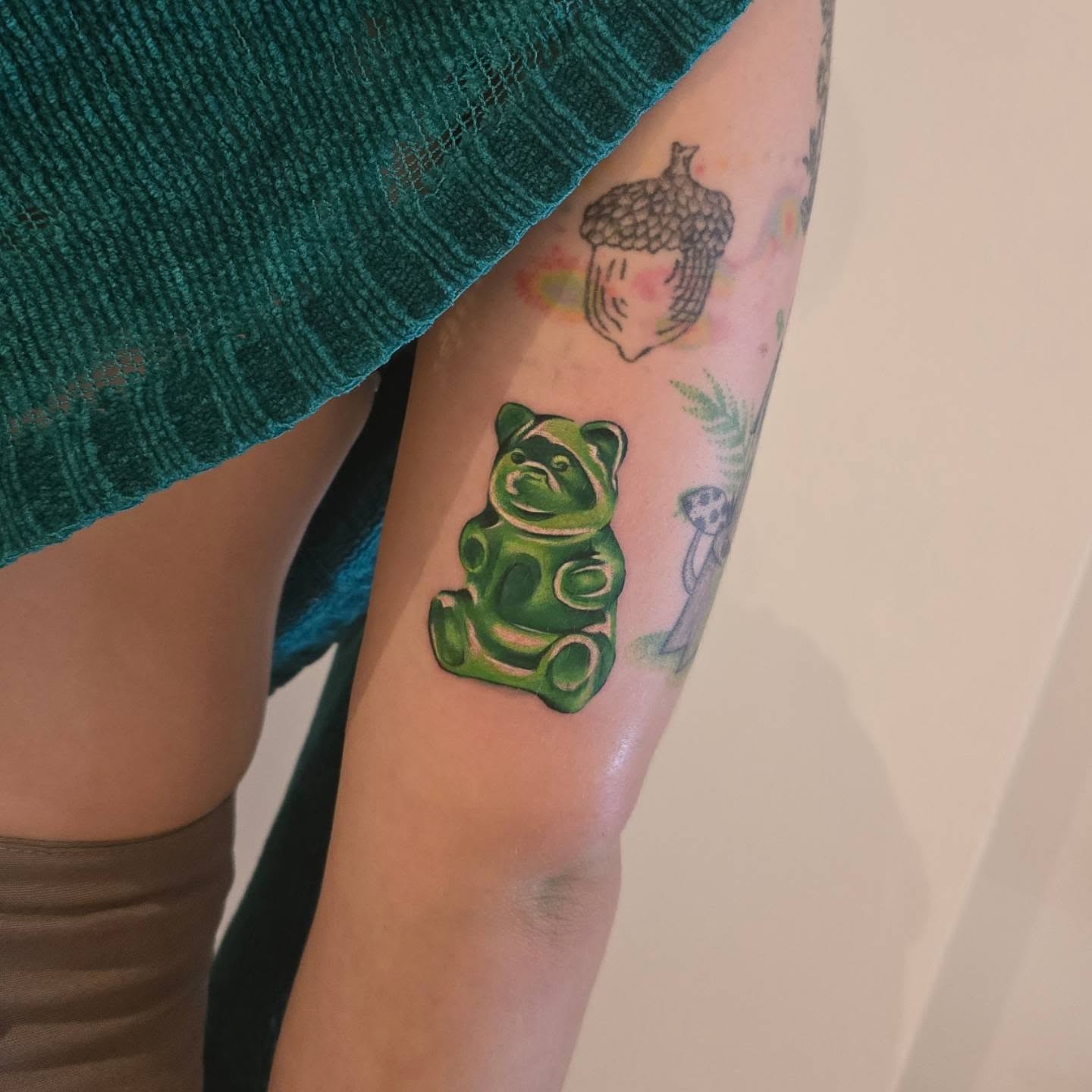 Gummy bear new school tattoo on the forearm by Lynx, Cincinnati, Ohio
