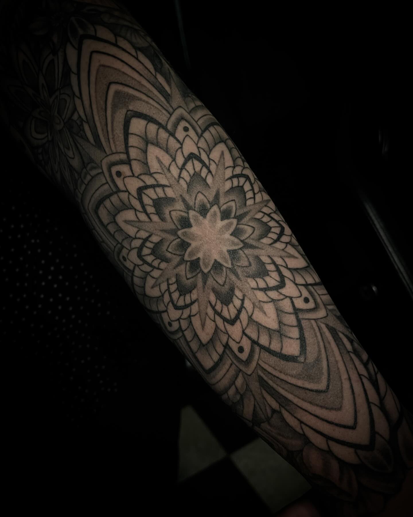 Mandala geometric tattoo on the forearm by Jacob Finelli