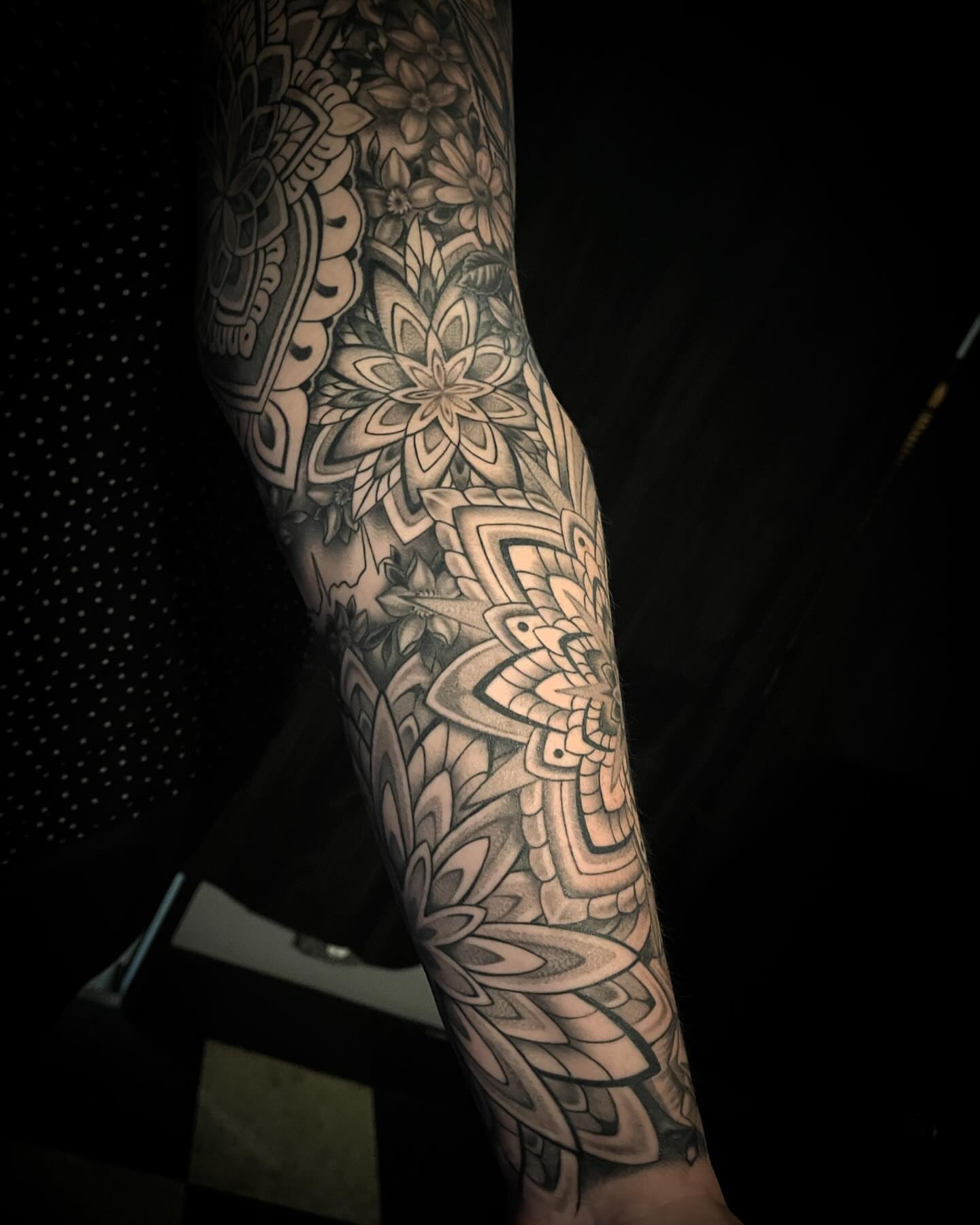 Floral mandala geometric tattoo on the forearm by Jacob Finelli