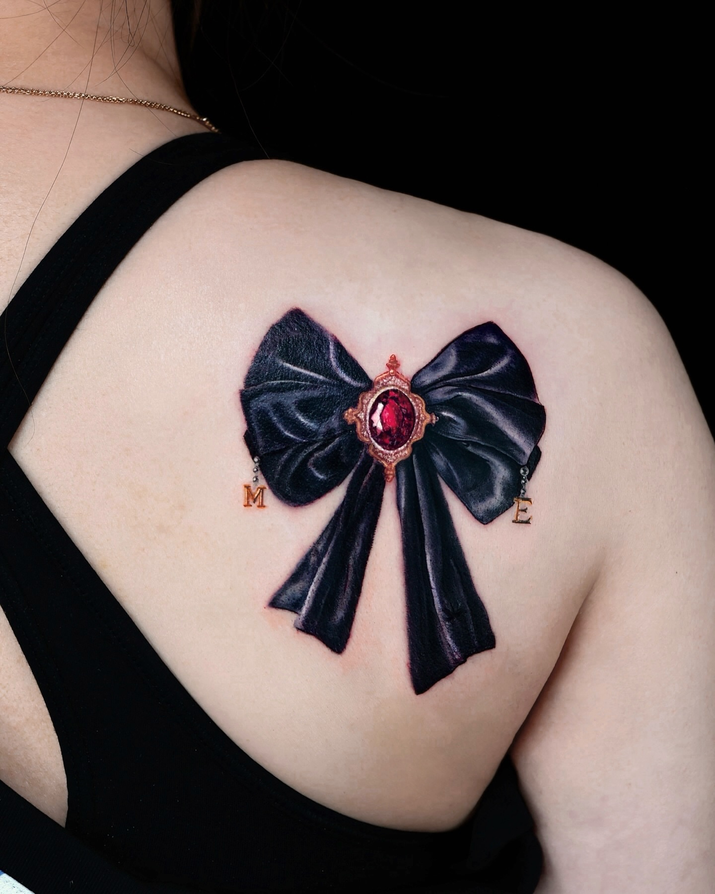 Bow realism tattoo on the shoulder by Adam_Zhiwei Xu(Tattooist)