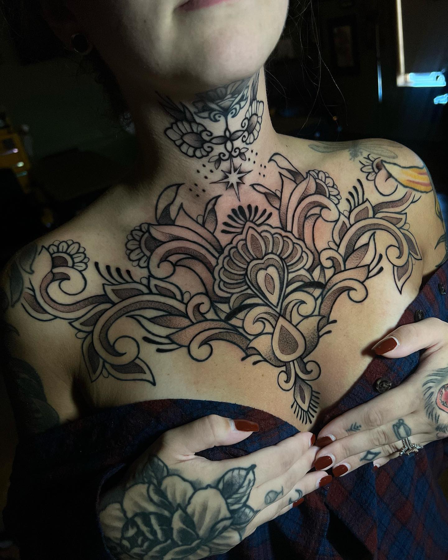 Floral bouquet ornamental tattoo on the chest by Bell Bolton