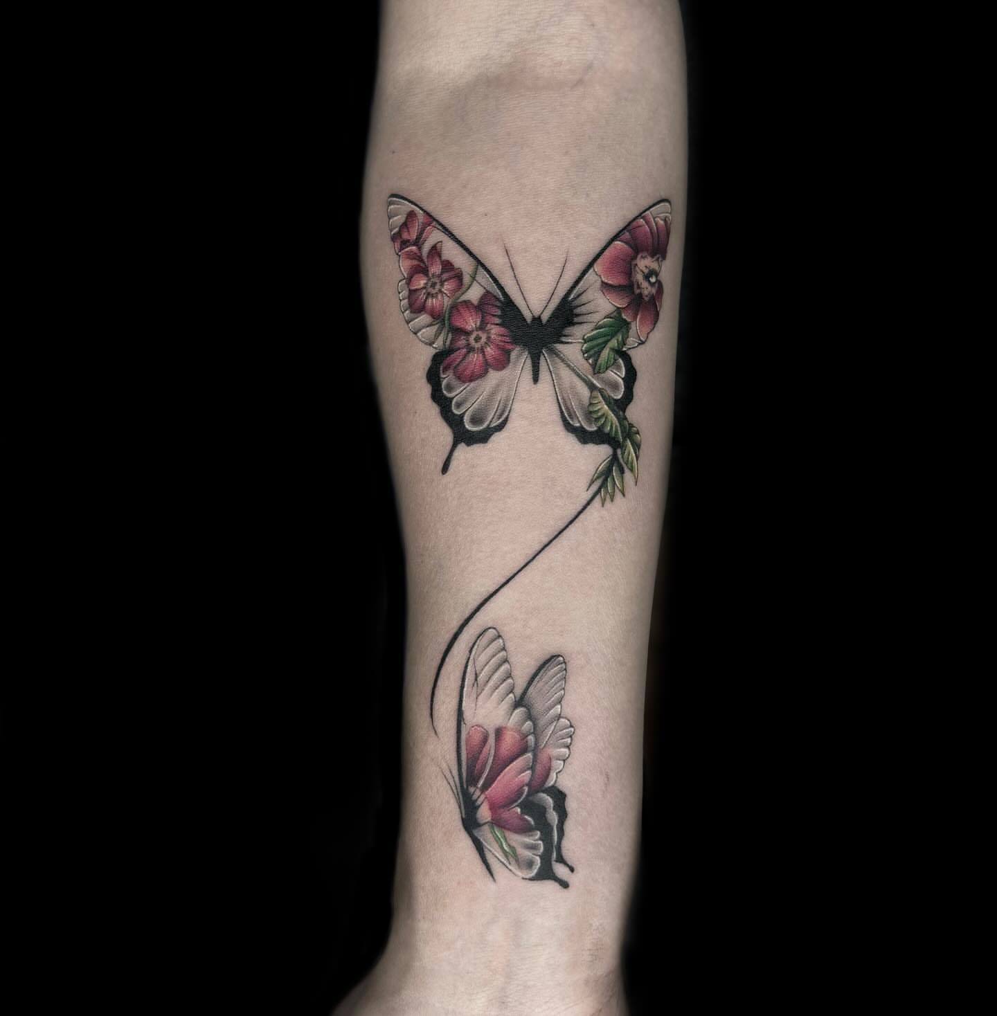 Butterfly new school tattoo on the forearm by Desirae✨