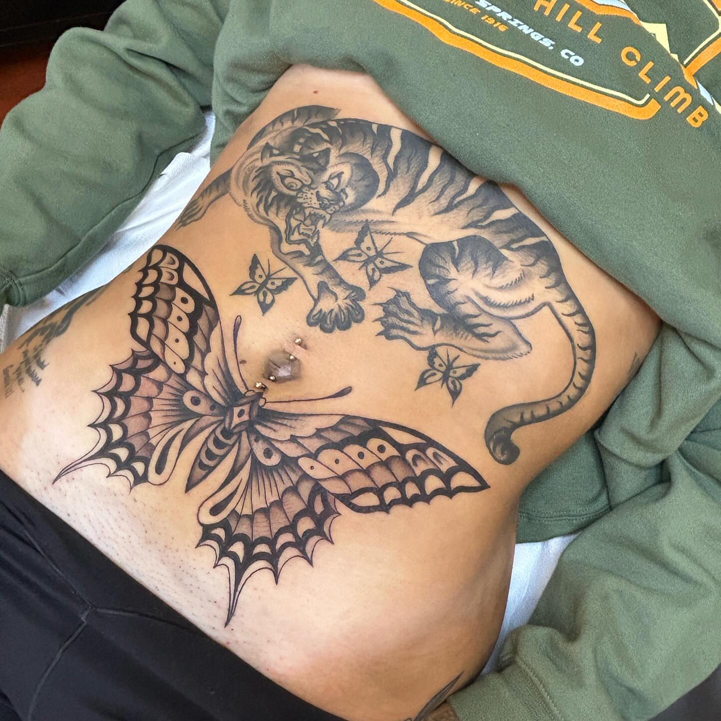 Butterfly and tiger black and grey tattoo on the ribs by Sam Perry, Denver, Colorado