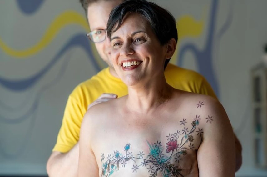 Floral design new school tattoo on the chest by Michelle