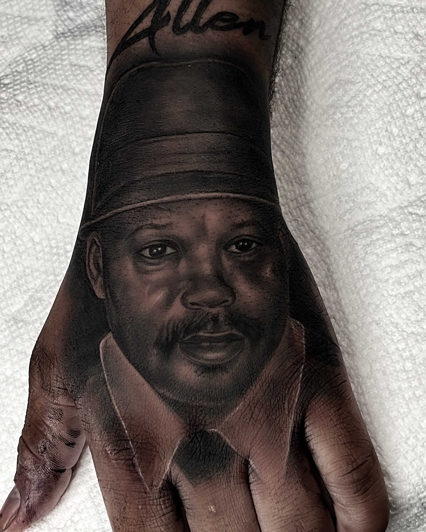 Portrait realism tattoo on the hand by Andy