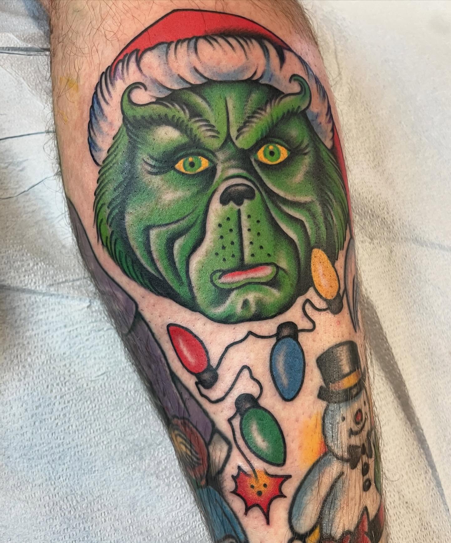 The grinch American traditional tattoo on the forearm by Grandma Approved, Chicago, Illinois