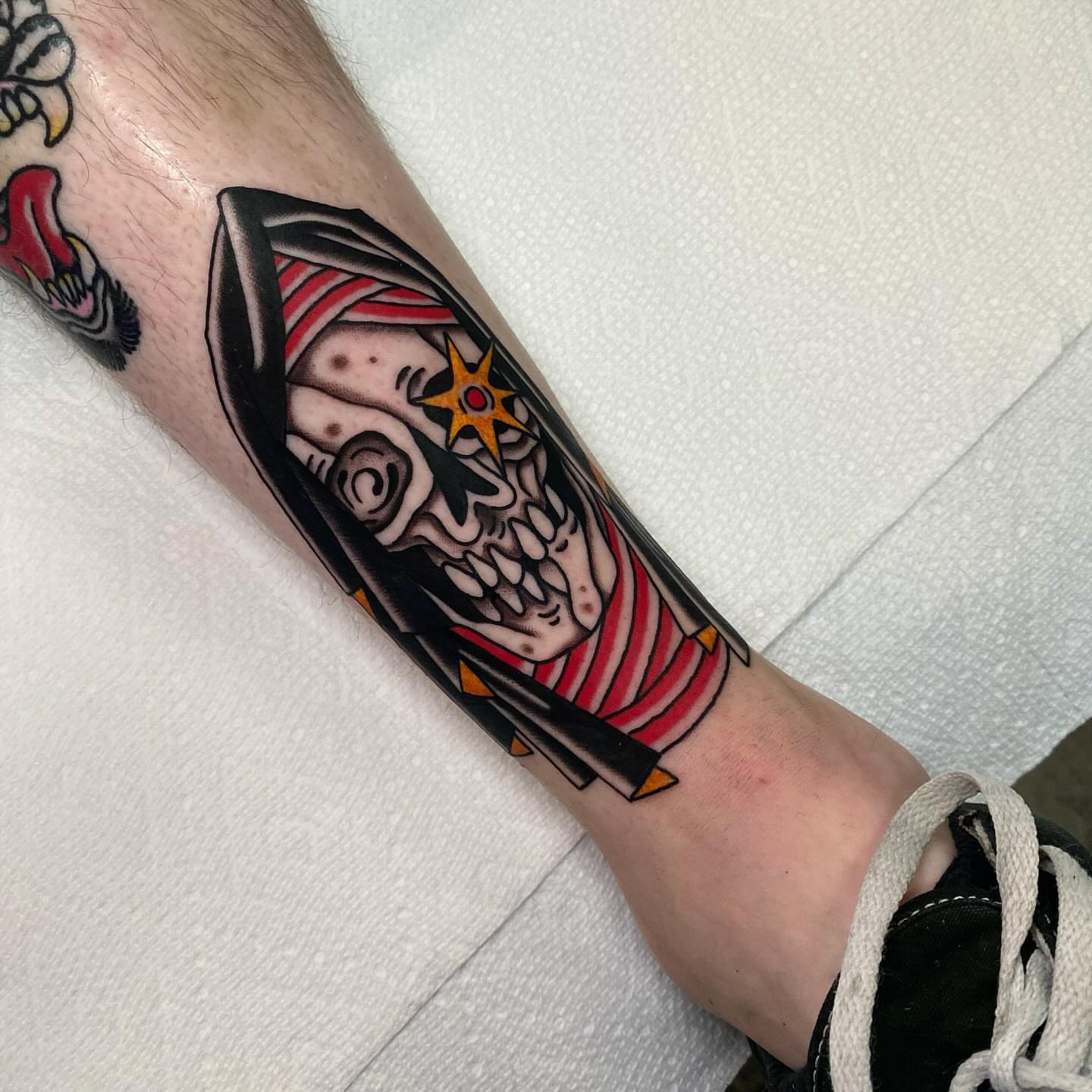 Skull American traditional tattoo on the forearm by Justin R. Mitchell, Fort Worth, Texas