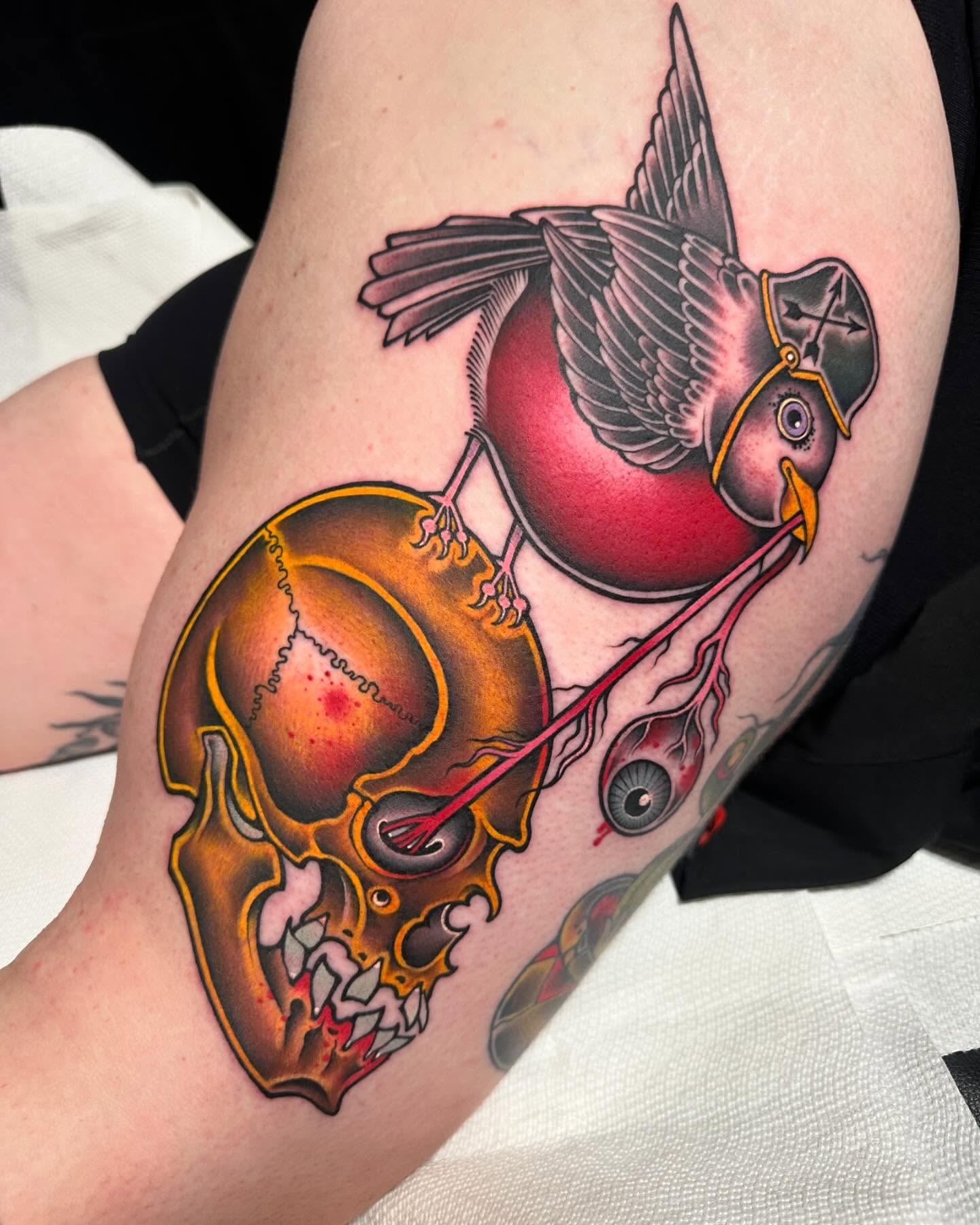Bird with helmet American traditional tattoo on the thigh by Mark Boller