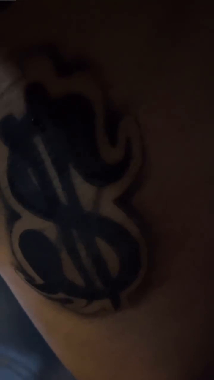 Dollar sign with flames tattoo on the forearm by Come Get Blasted By Chula💥
