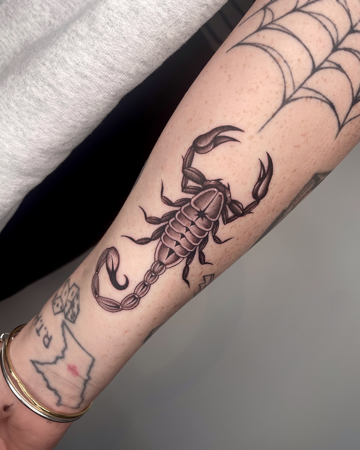 Scorpion black and grey tattoo on the forearm by LA tattoo