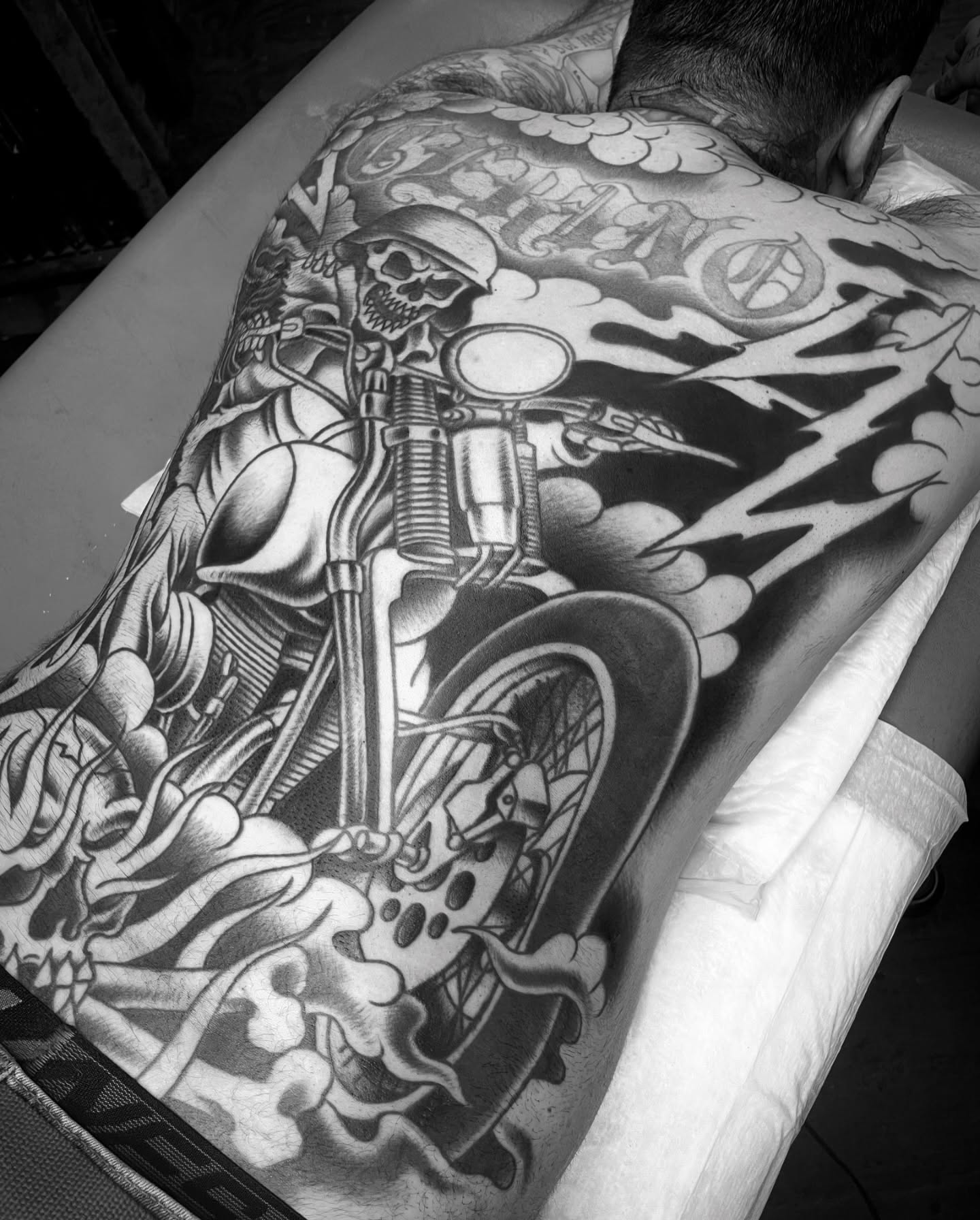 Motorcycle skeleton American traditional tattoo on the back by Tom Taylor, Philadelphia, Pennsylvania