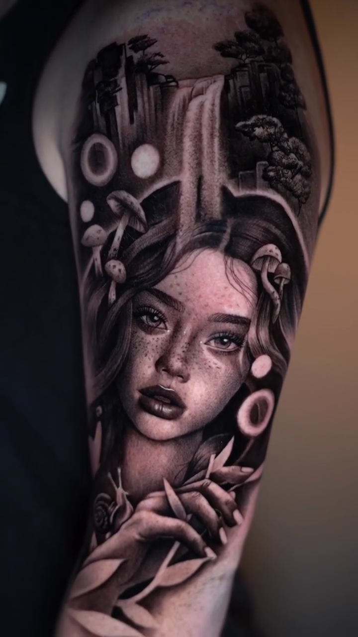 Woman with waterfall and plants realism tattoo by Risa