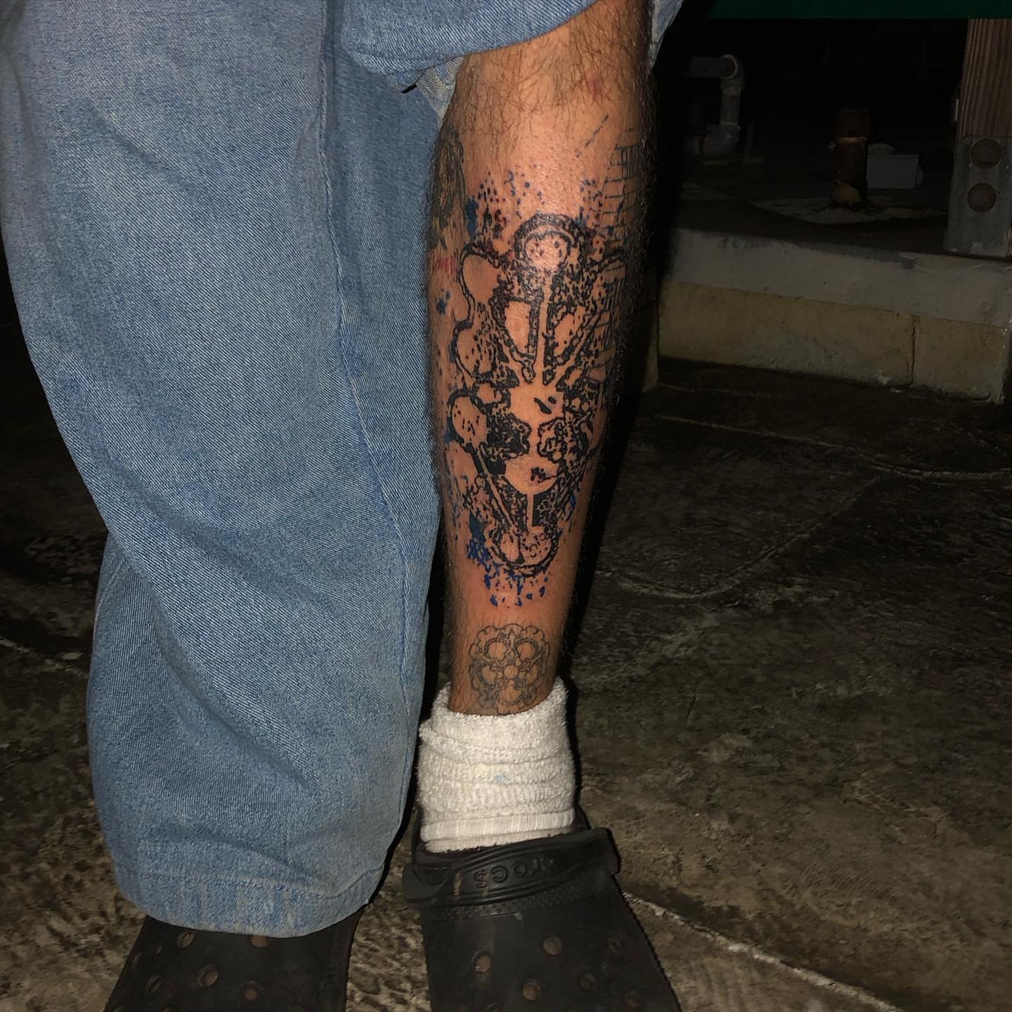 Abstract splatter dotwork tattoo on the calf by @emotionalthugtattoo