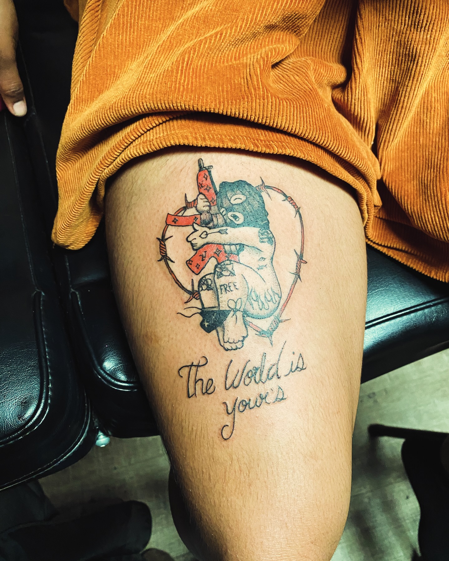 Bear and banner American traditional tattoo on the thigh by Rico Rosario