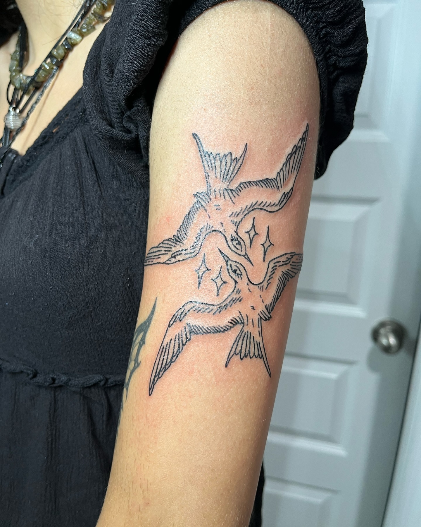 Birds black and grey tattoo on the forearm by layne