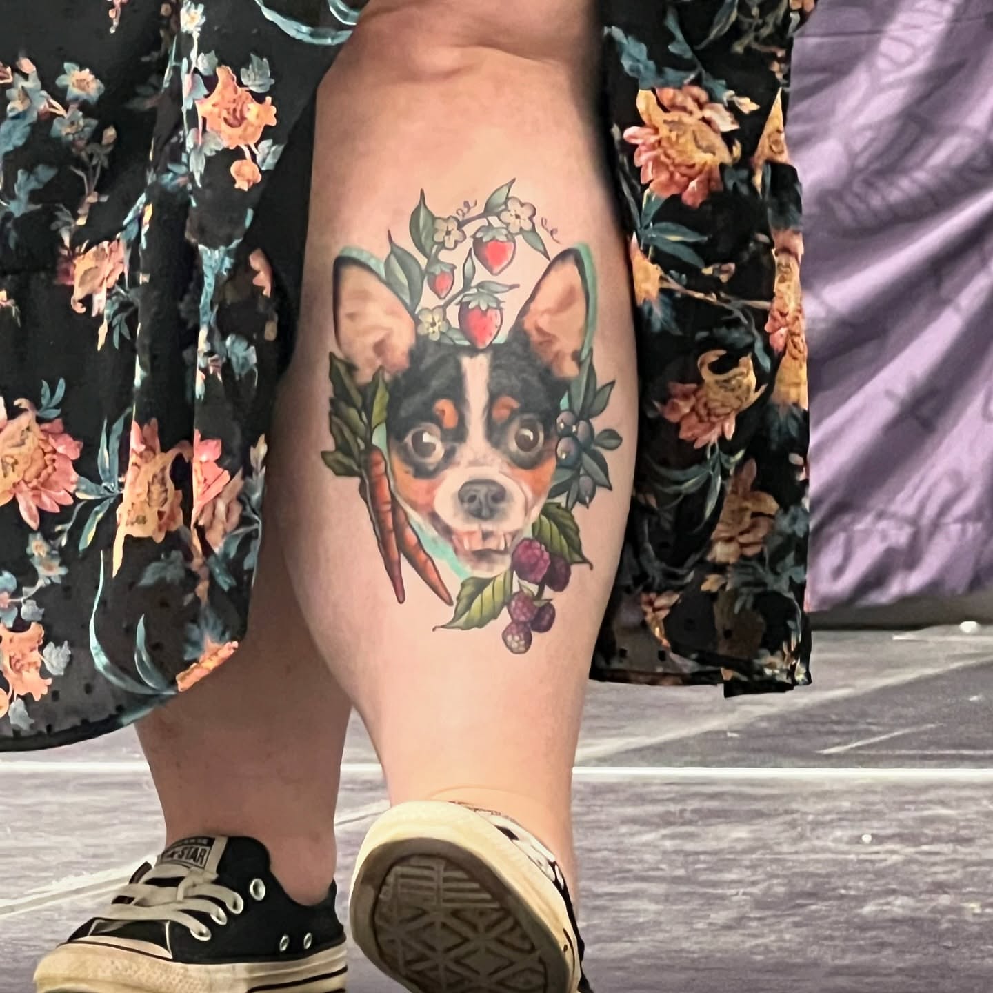 Dog with floral elements realism tattoo on the thigh by Blu