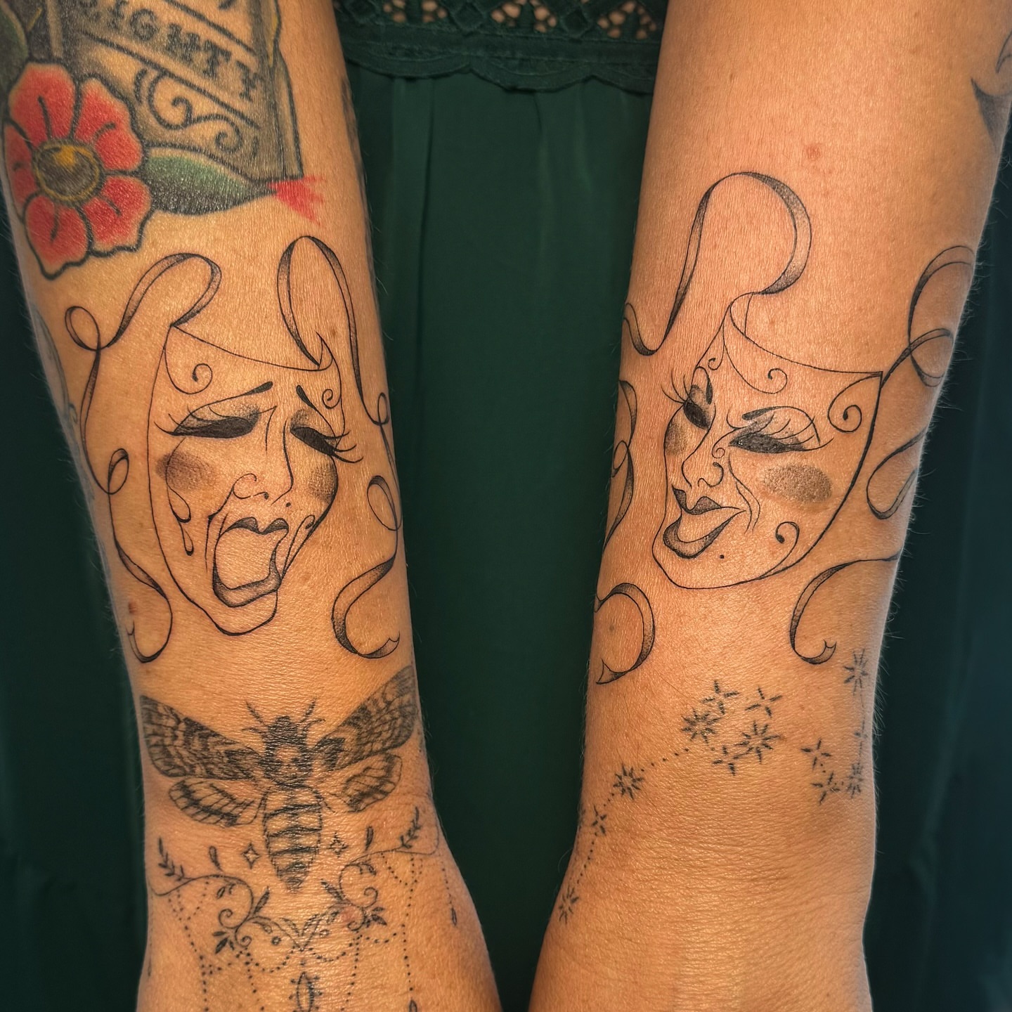 Mask black and grey tattoo on the forearm by RyAnn Lynn