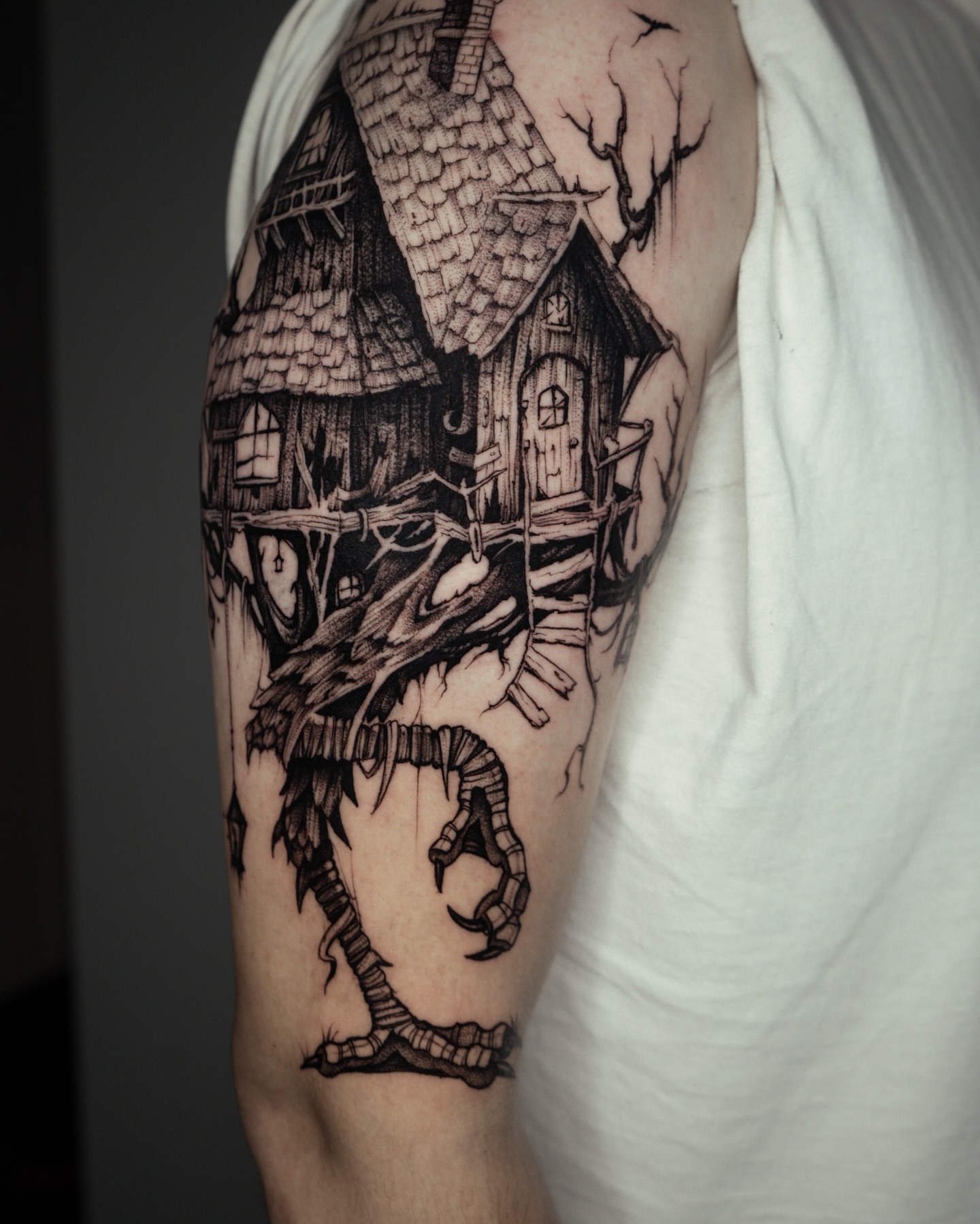 Haunted house with dragon realism tattoo on the forearm by Bruna Bianculli