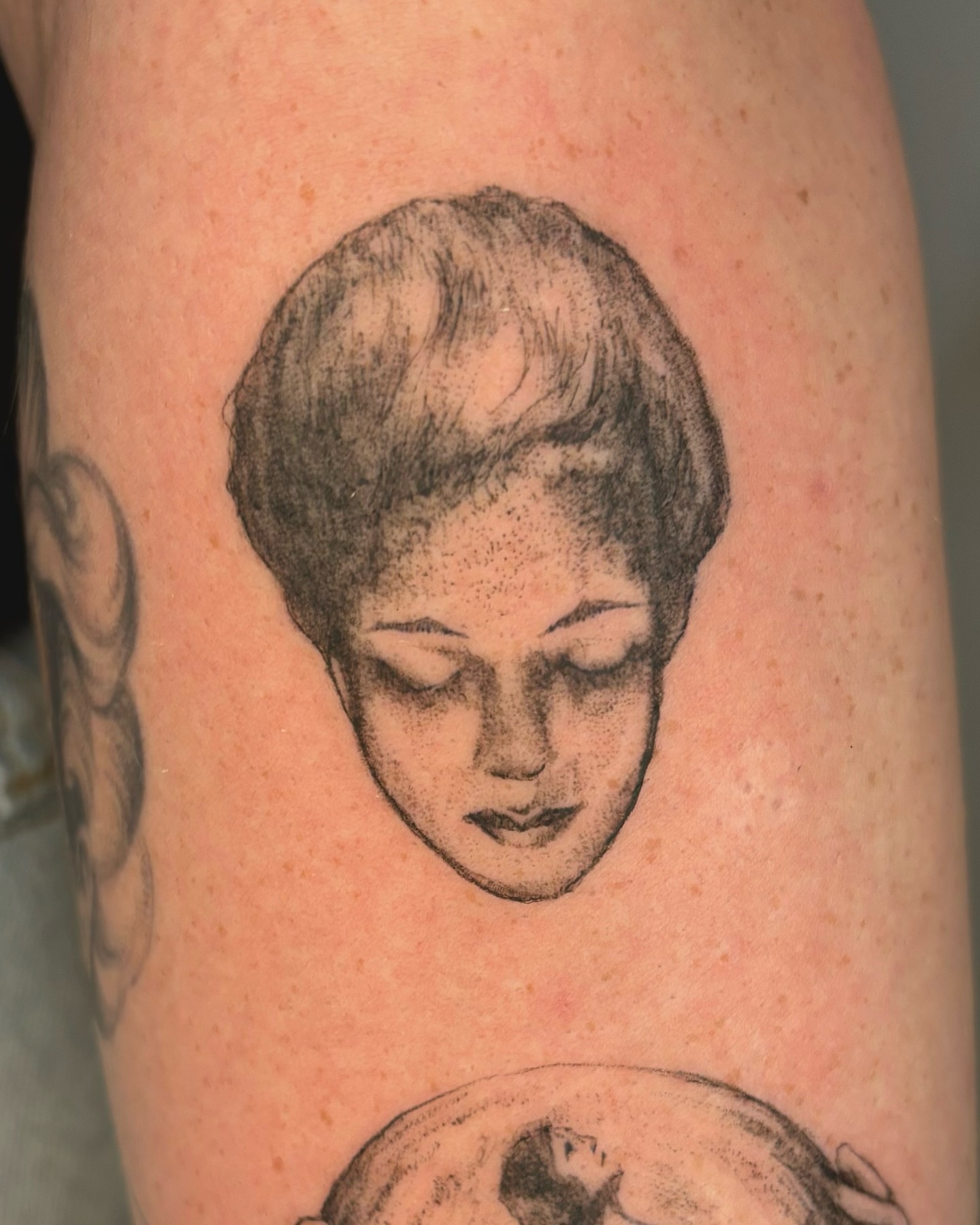 Woman's head dotwork tattoo on the forearm by Wren Cavanaugh Tattoos, Seattle, Washington