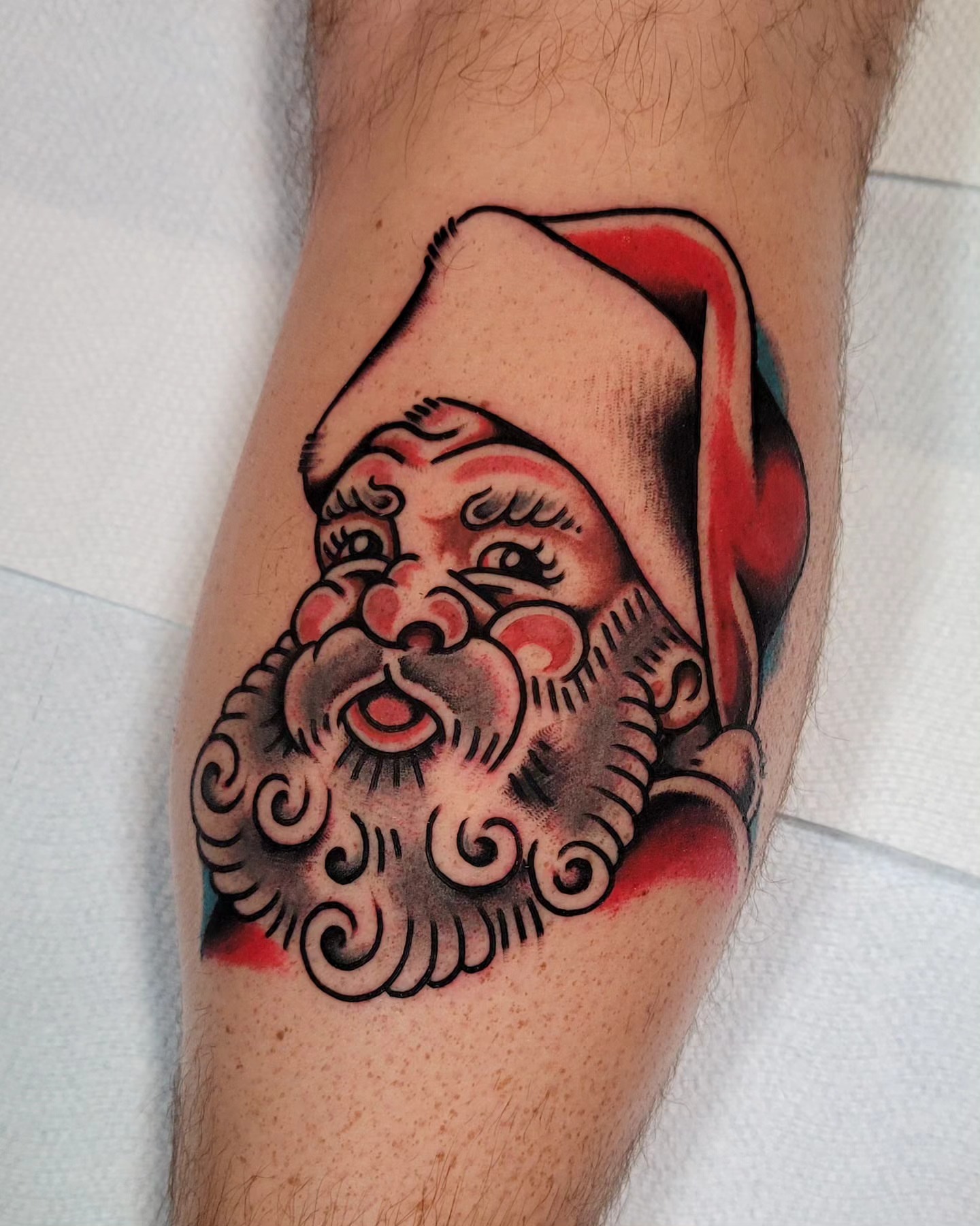 Santa Claus American traditional tattoo on the forearm by J. Kirsch New Jersey Tattoo Artist
