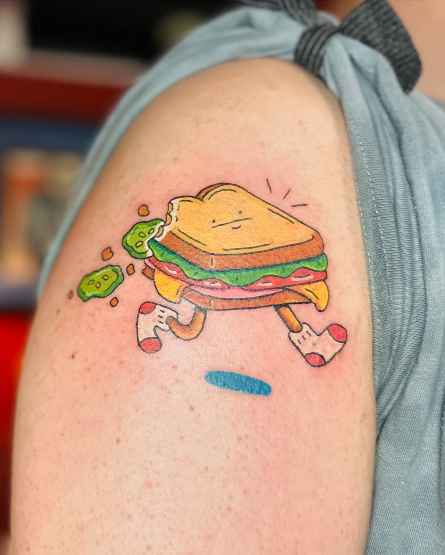 Sandwich illustrative tattoo on the shoulder by Kellie Burch