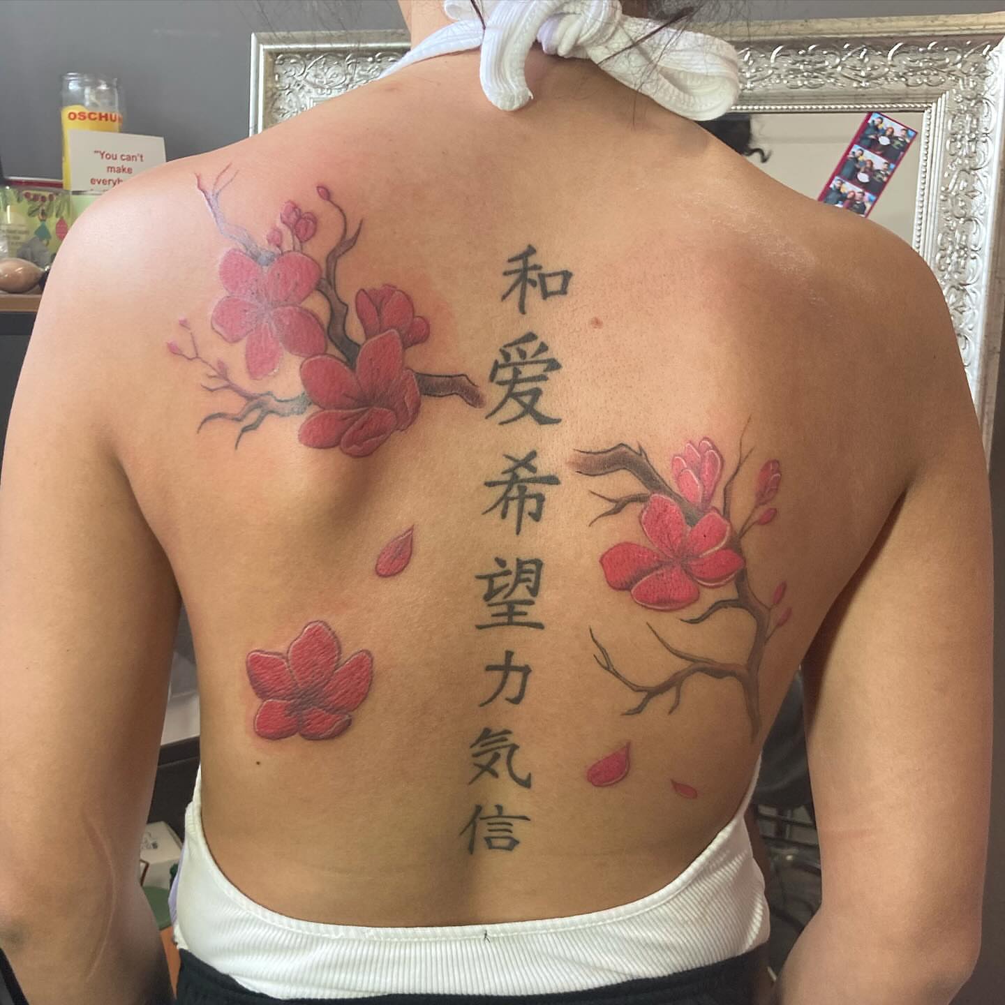 Cherry blossoms and kanji japanese irezumi tattoo on the back by Detroit Tattoo Artist