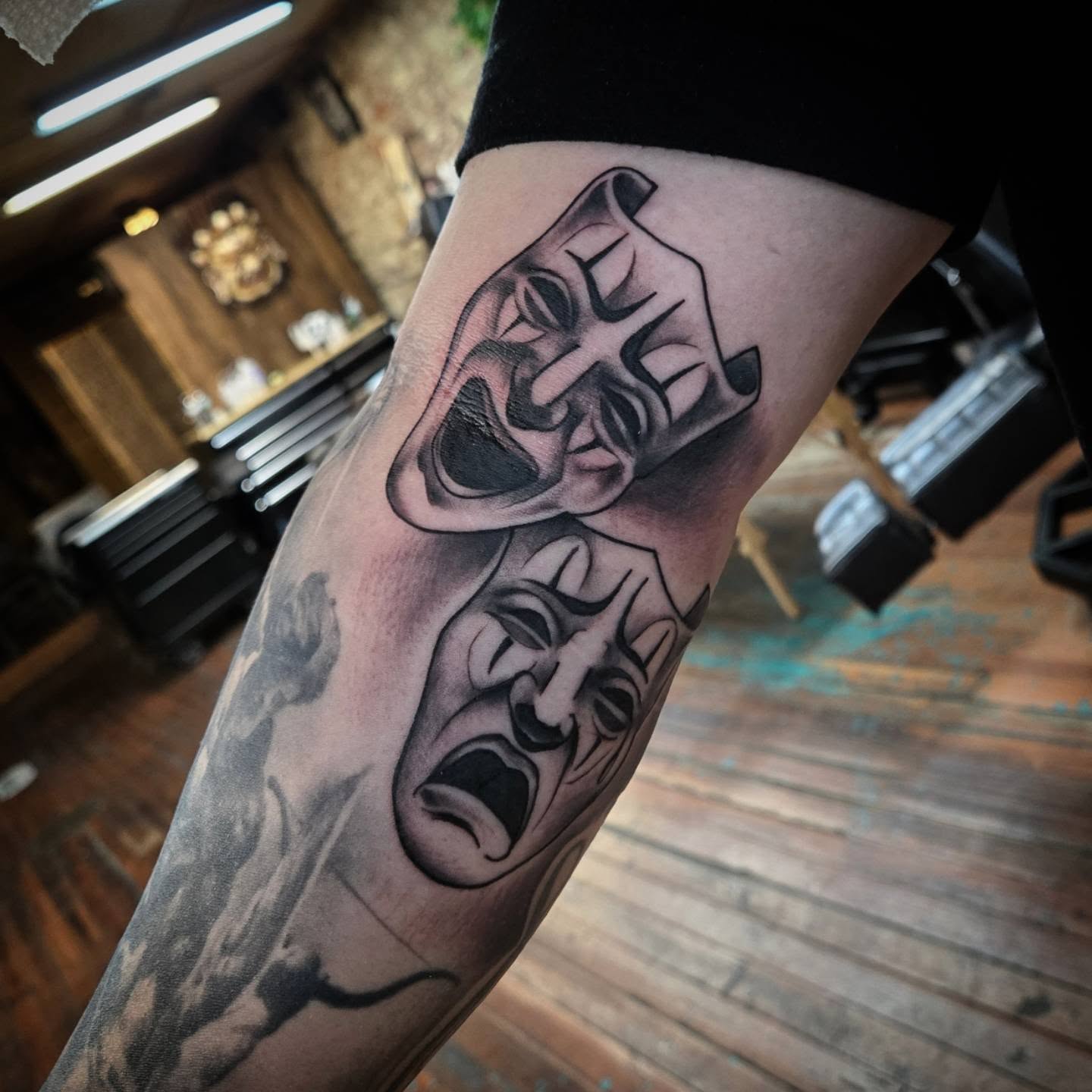 Theatrical masks realism tattoo on the forearm by DiazTattoos, Denver, Colorado