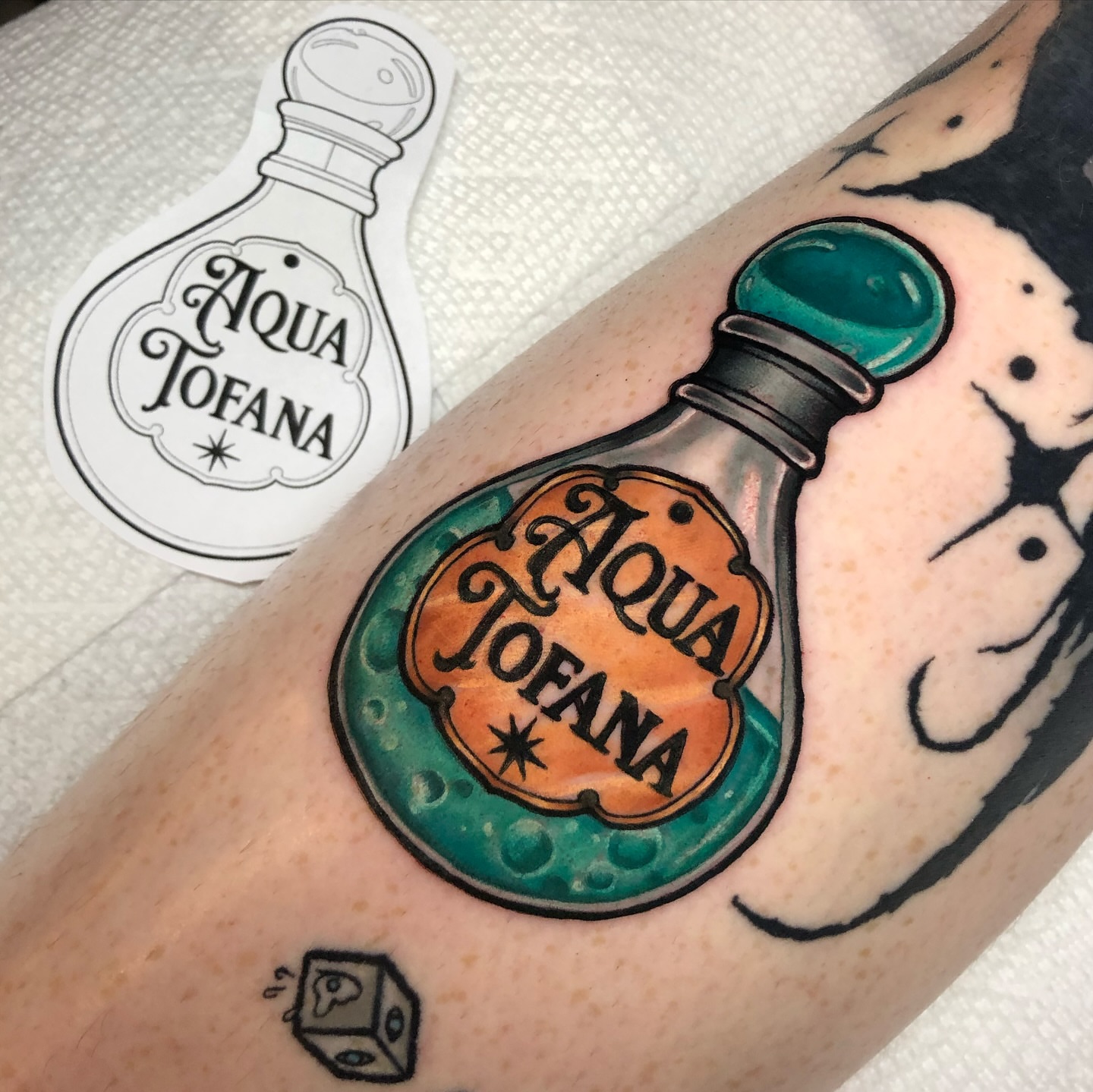 Aqua Tofana potion bottle dotwork tattoo on the forearm by Melissa Brown