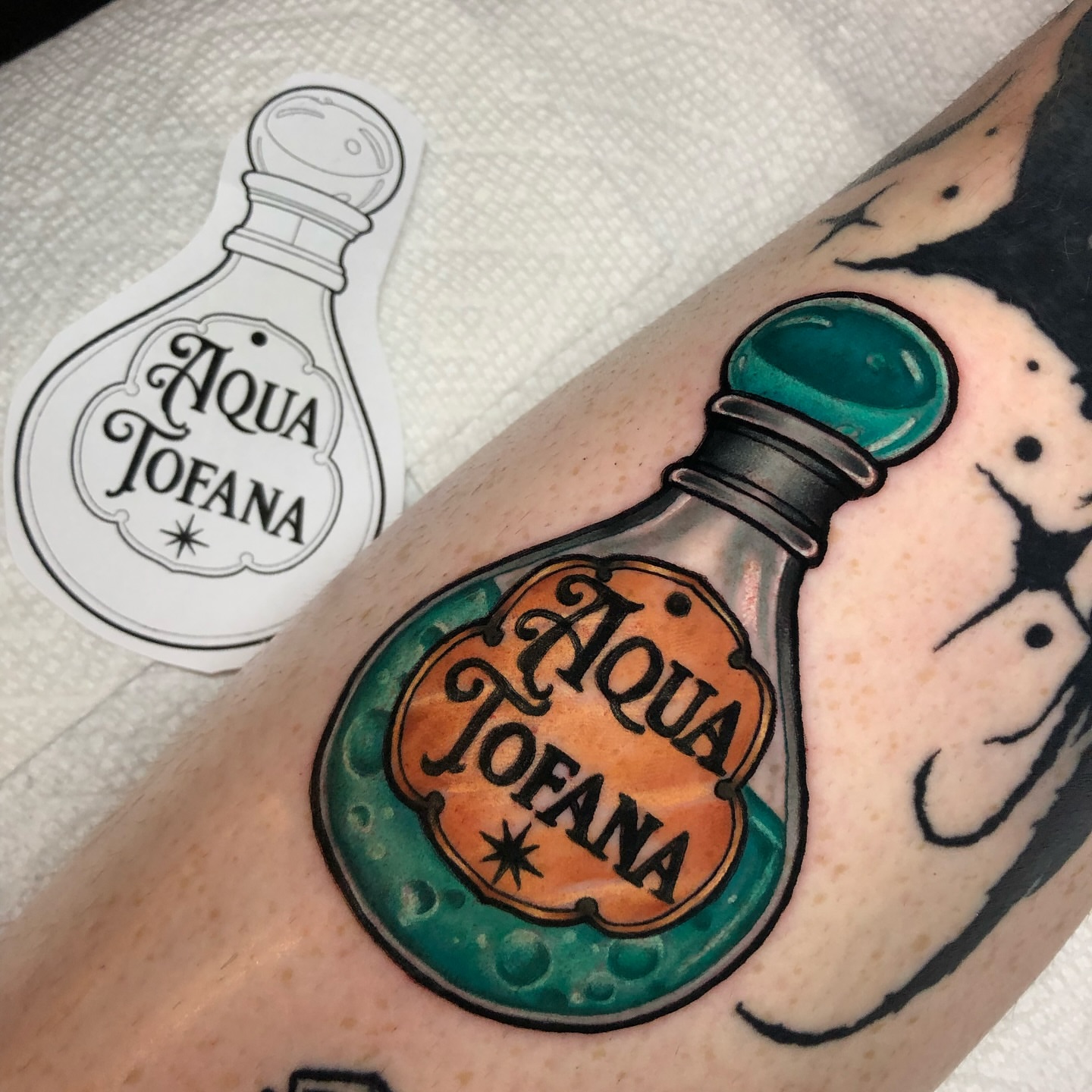 Aqua Tofana potion bottle dotwork tattoo on the forearm by Melissa Brown