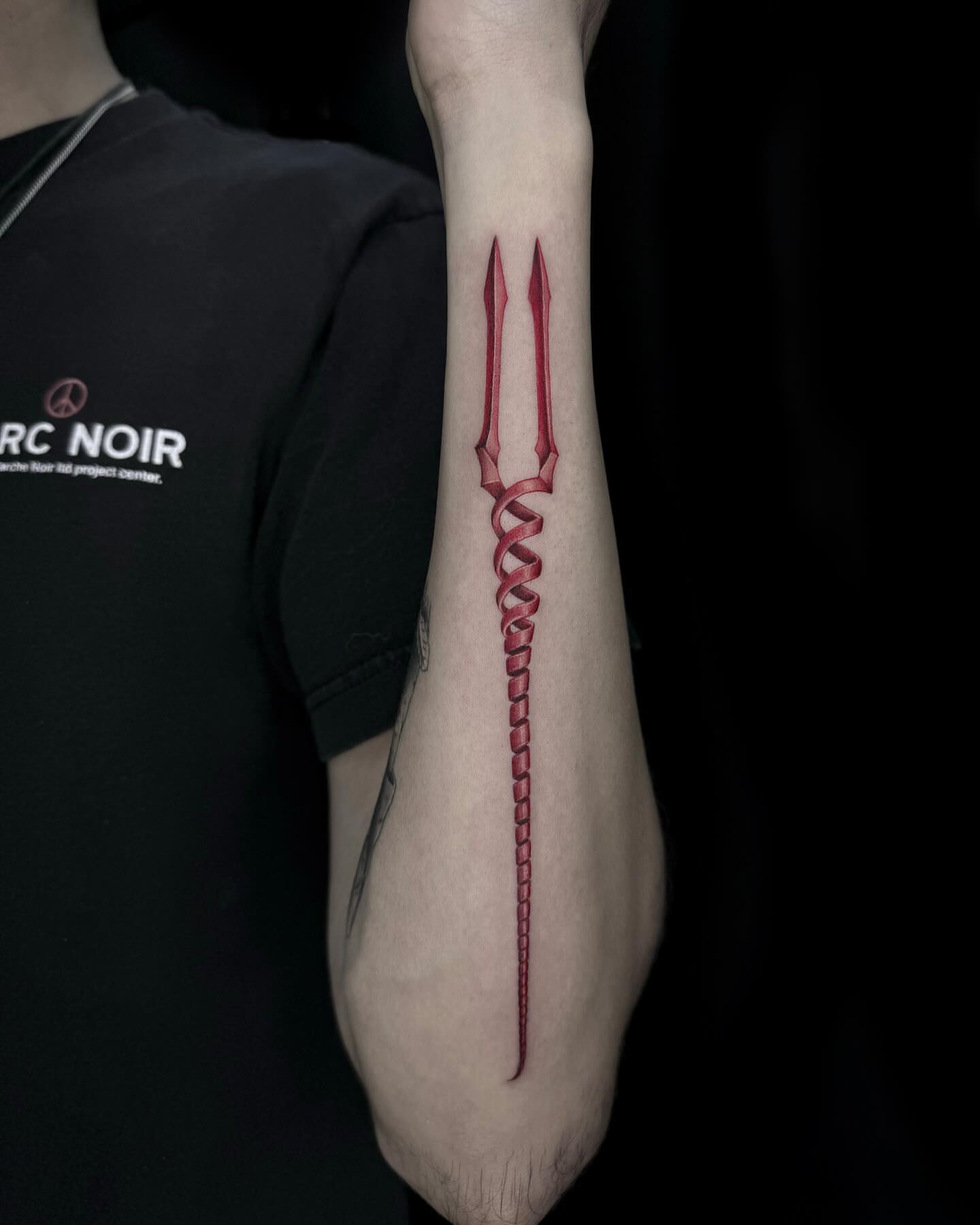 Trident geometric tattoo on the forearm by Desirae✨