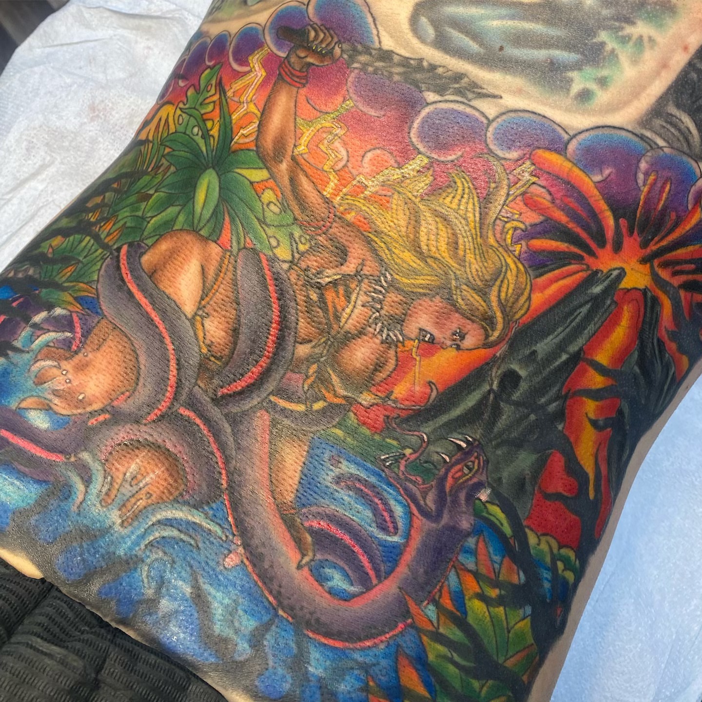 Mermaid and dragon new school tattoo on the forearm by Jacie Aasen-Lupino