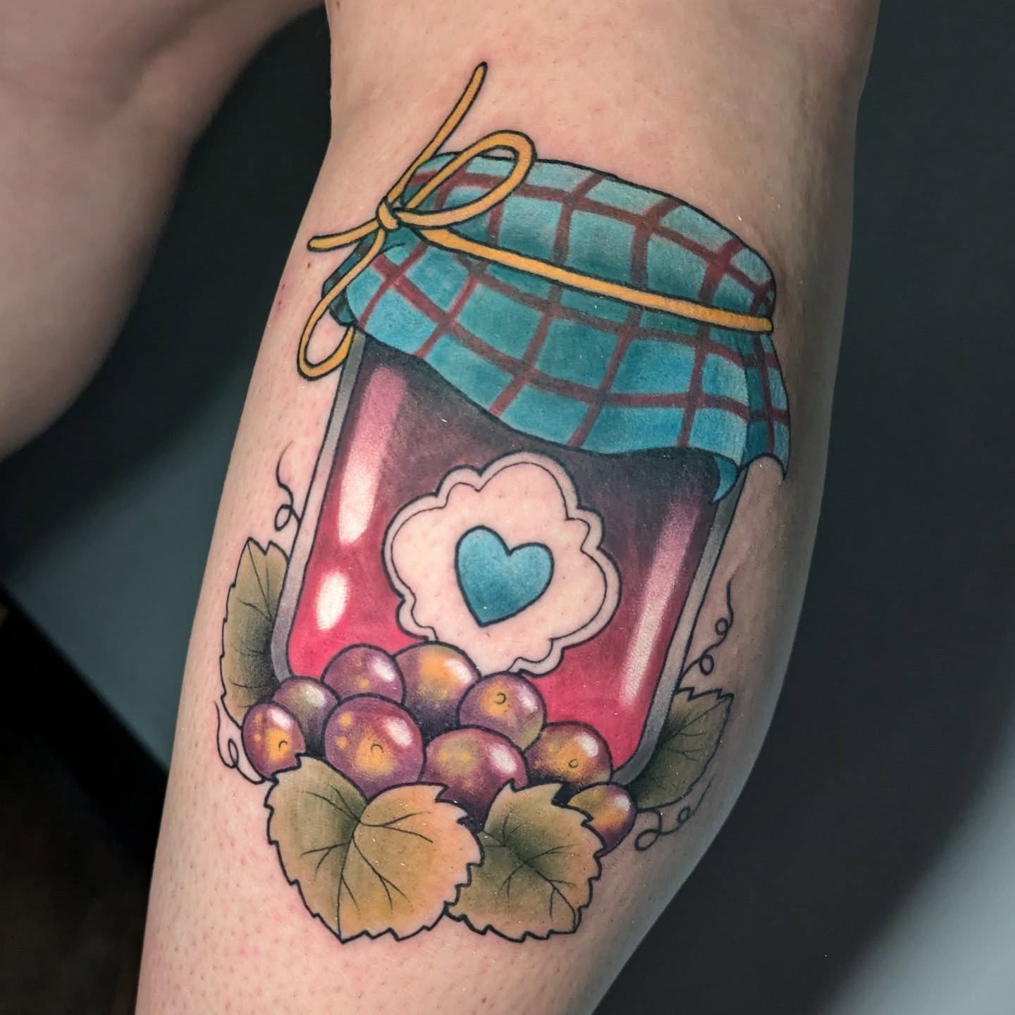 Grape jam jar American traditional tattoo on the forearm by Ellie