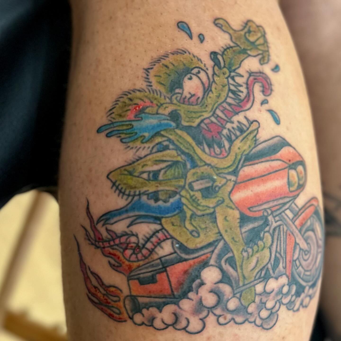 Monster riding motorcycle American traditional tattoo on the thigh by 𝕯𝖗𝖆𝕶𝖊㋛