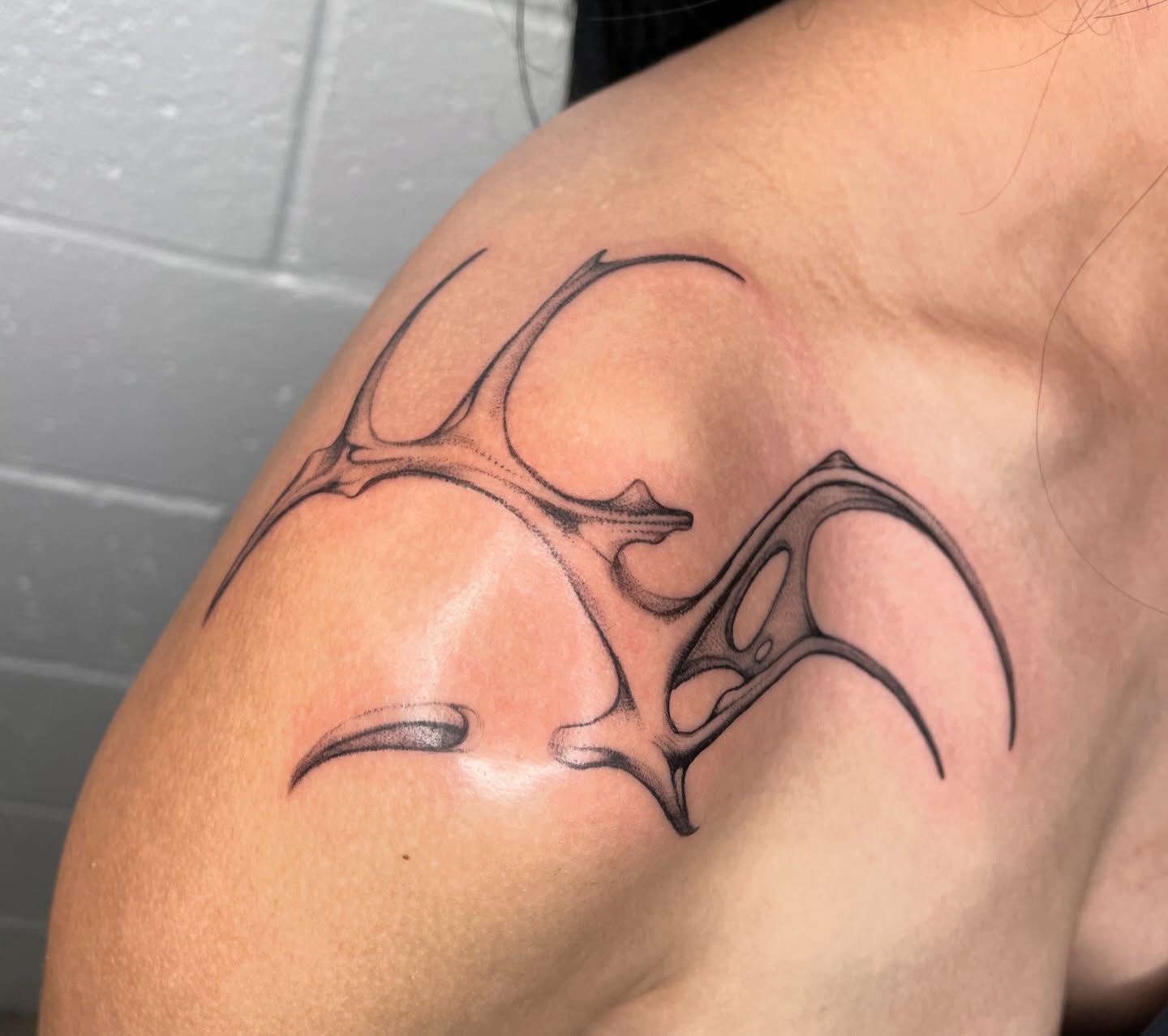 Bat black and grey tattoo on the shoulder by 𝕮𝖆𝖗𝖔𝖑𝖎𝖓𝖊 𝕽𝖆𝖊 𝕽𝖔𝖇𝖎𝖓𝖘𝖔𝖓, Los Angeles, California